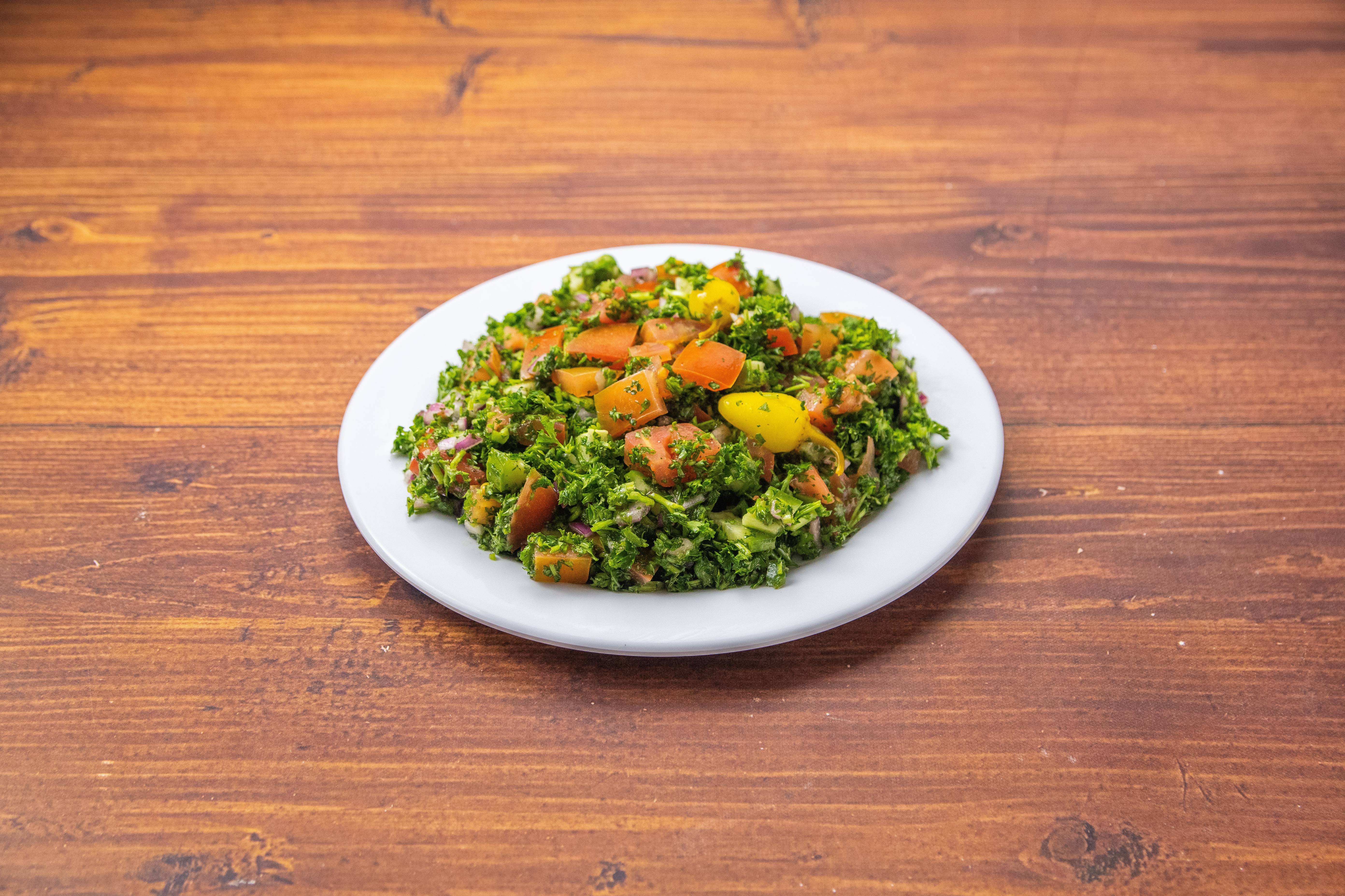 Order Tabbouleh Salad food online from Blue Water Cafe store, Los Angeles on bringmethat.com