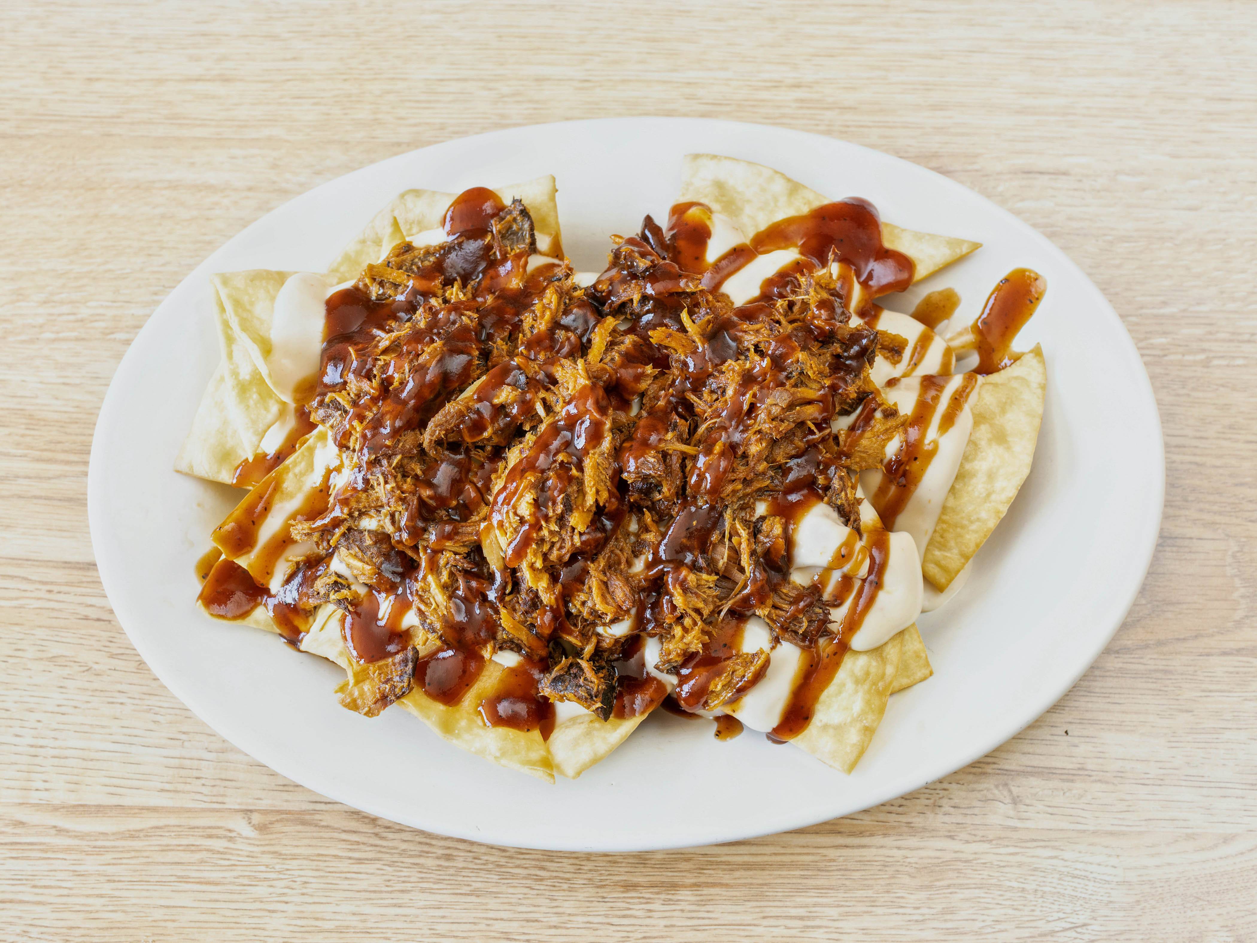 Order Pulled Pork Nachos food online from Disilvios Family Grill store, Hubbard on bringmethat.com