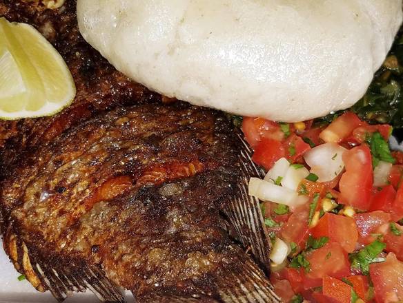 Order TIapia fish with ugali and greens  food online from Kilimanjaro Grill store, Minneapolis on bringmethat.com
