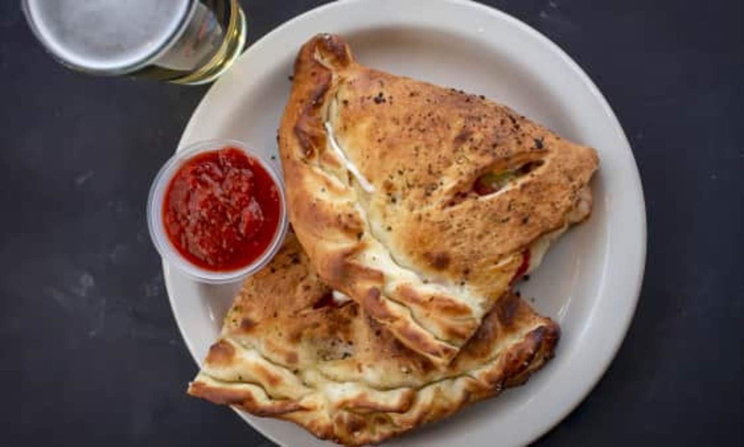 Order Build Your Own Calzone food online from The Post Sports Bar & Grill store, Creve Coeur on bringmethat.com