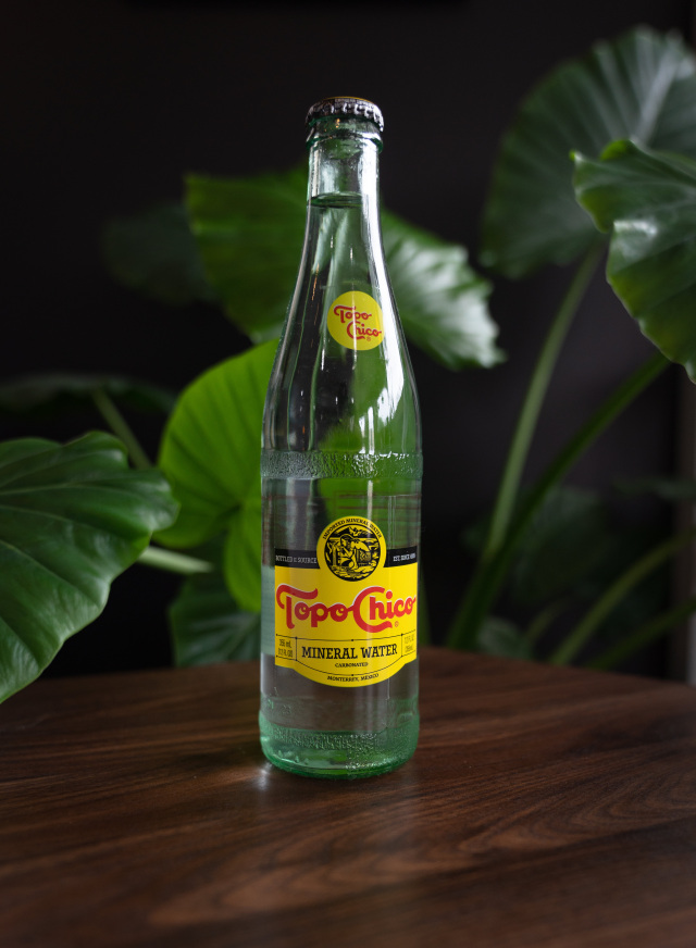 Order 12 oz. Topo Chico food online from Black Coffee store, Fort Worth on bringmethat.com