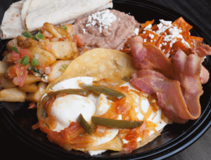 Order Huevos Rancheros Breakfast food online from Tostada Regia store, Houston on bringmethat.com