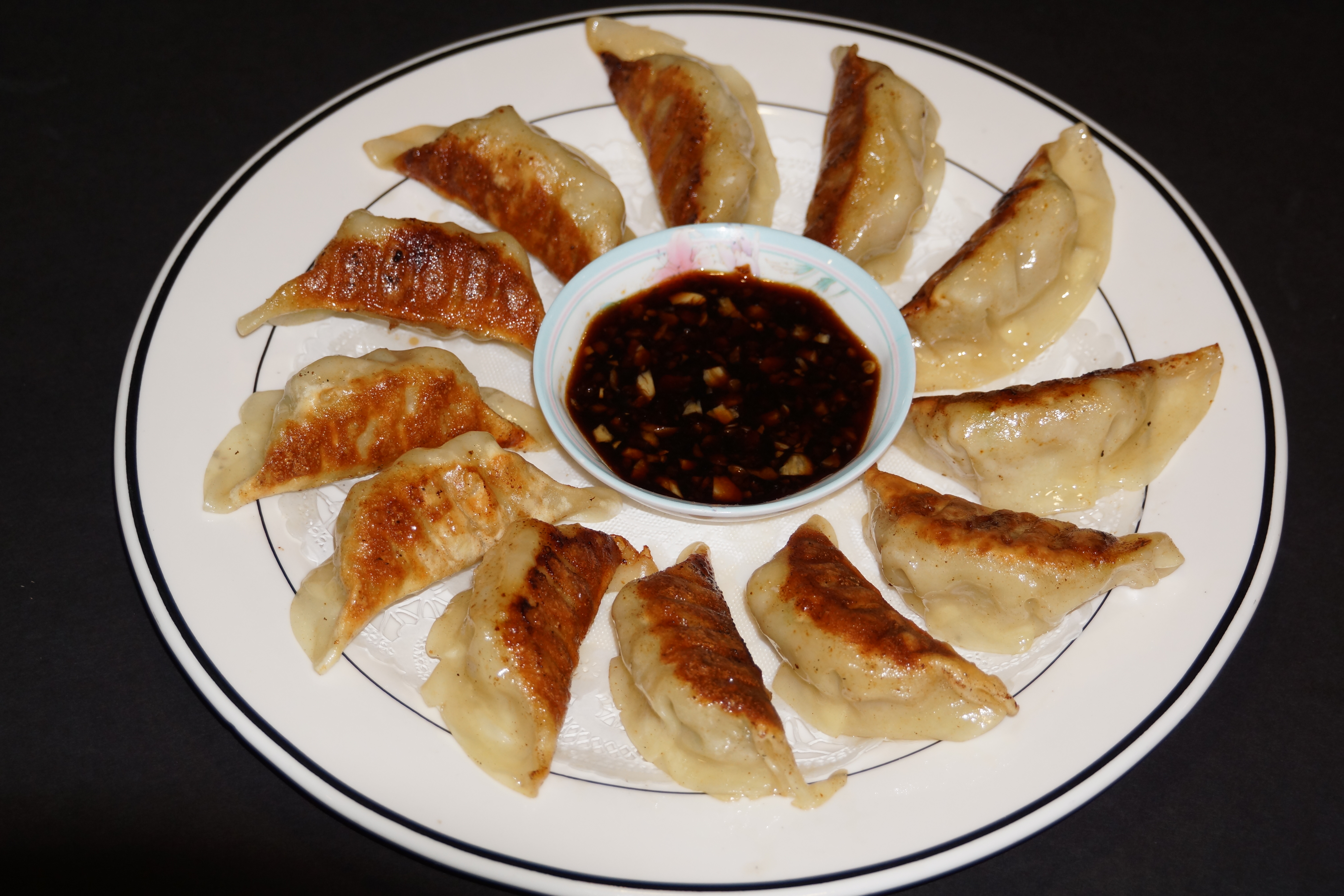 Order 4. Pan Fried Chicken Dumplings food online from Mandarin Chinese Cuisine store, Covina on bringmethat.com