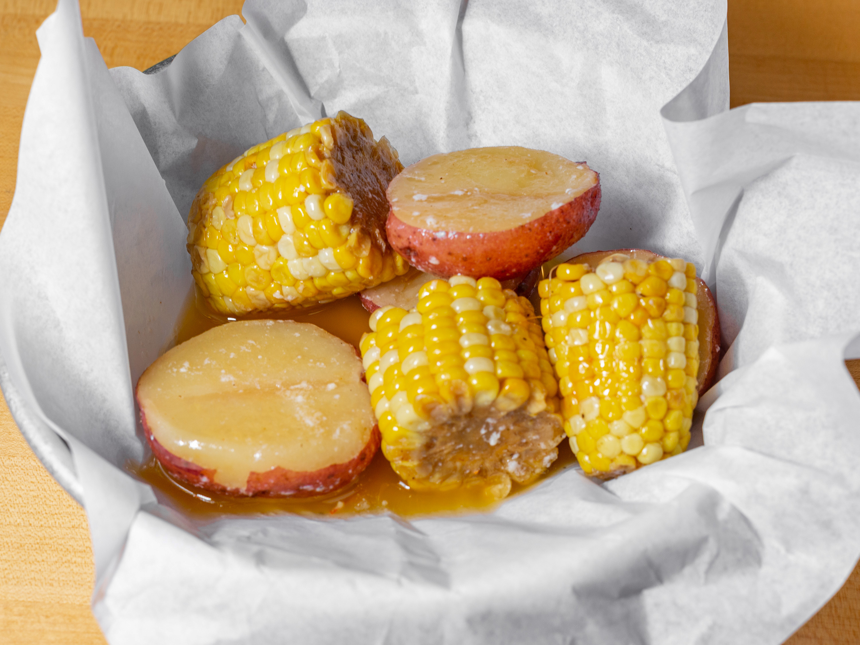Order Potatoes & Corn food online from Dirty Al's Seafood Market & Cajun Kitchen store, Brownsville on bringmethat.com