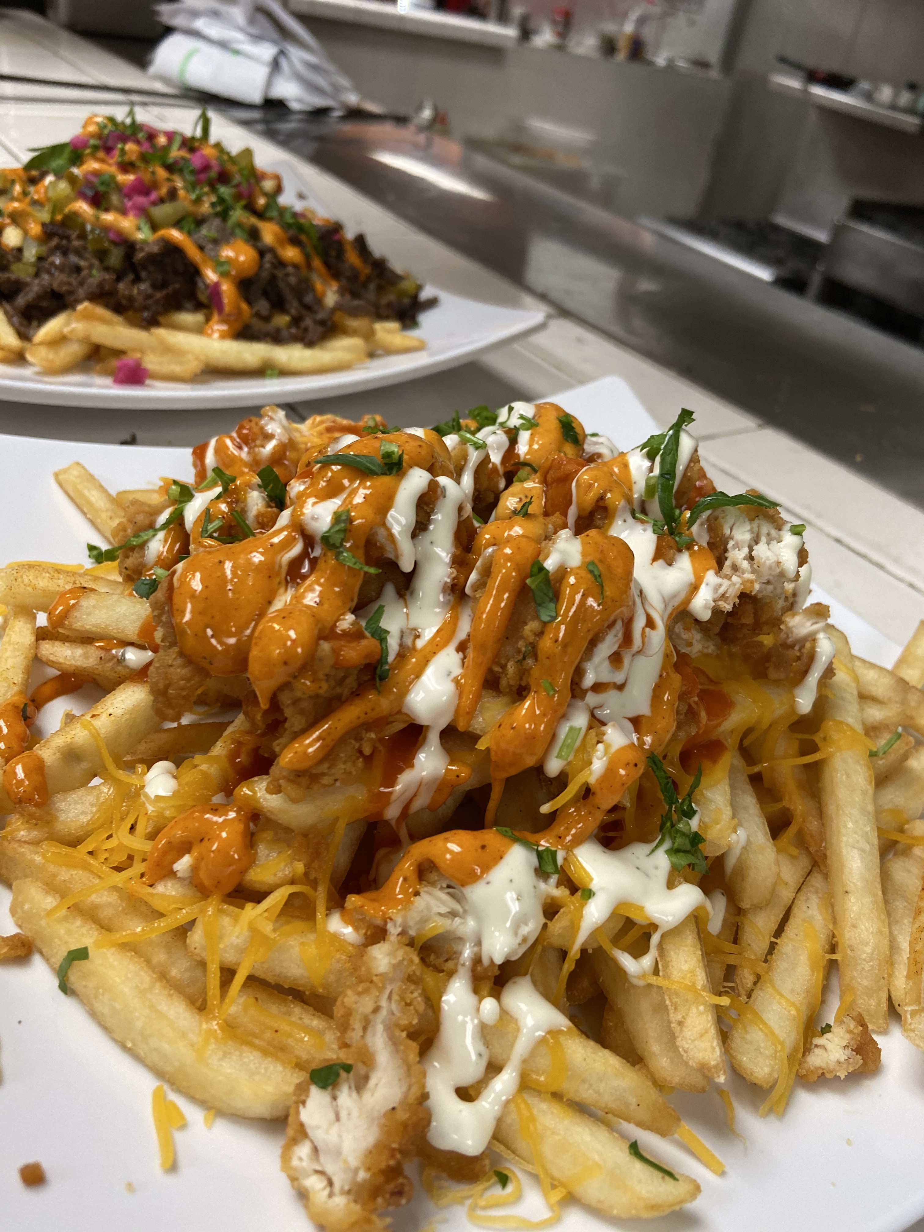 Order Buffalo chicken zinger fries food online from World Famous Grill store, Bell Gardens on bringmethat.com