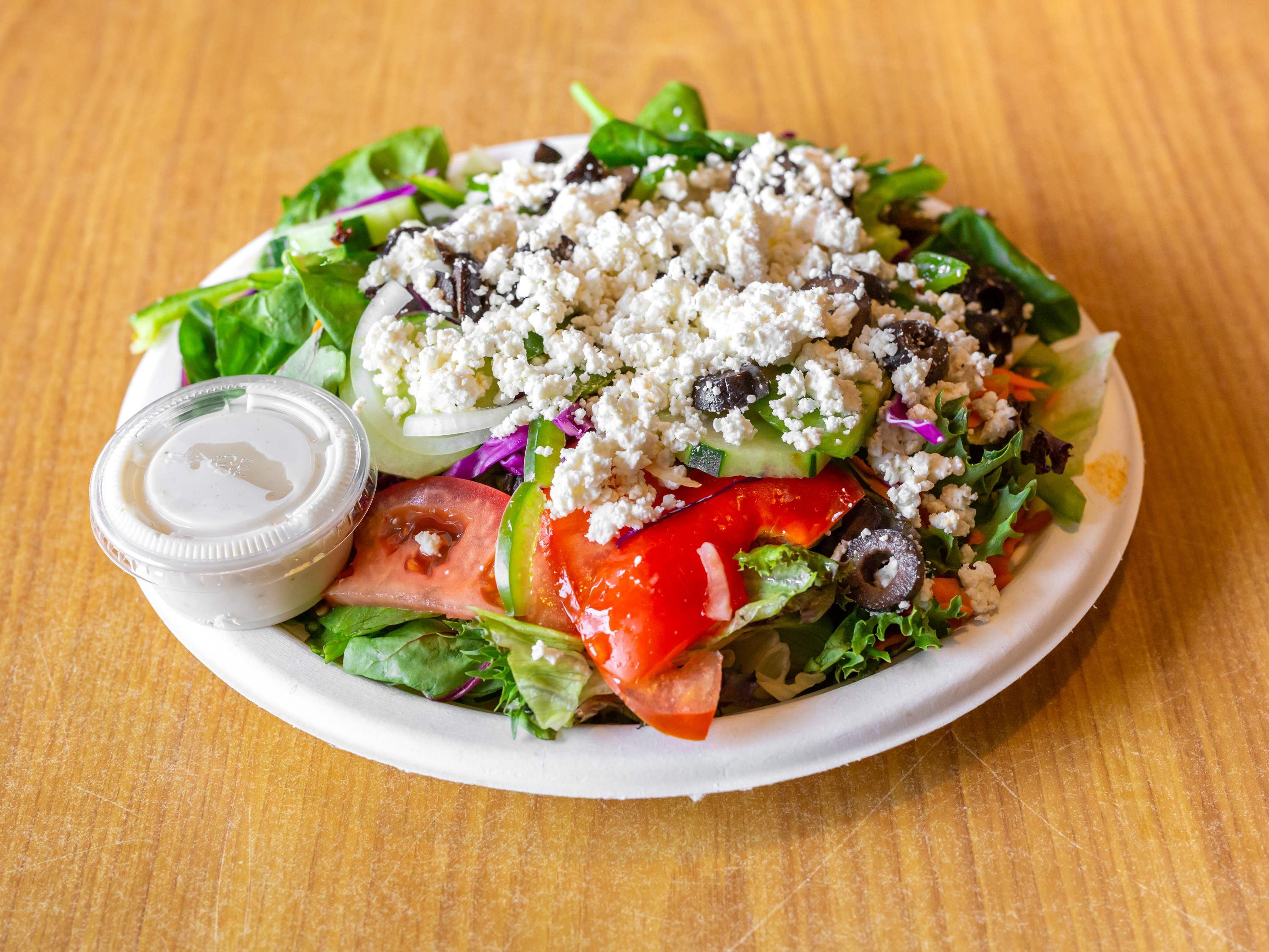 Order Greek Salad food online from Inbound Pizza store, Allston on bringmethat.com