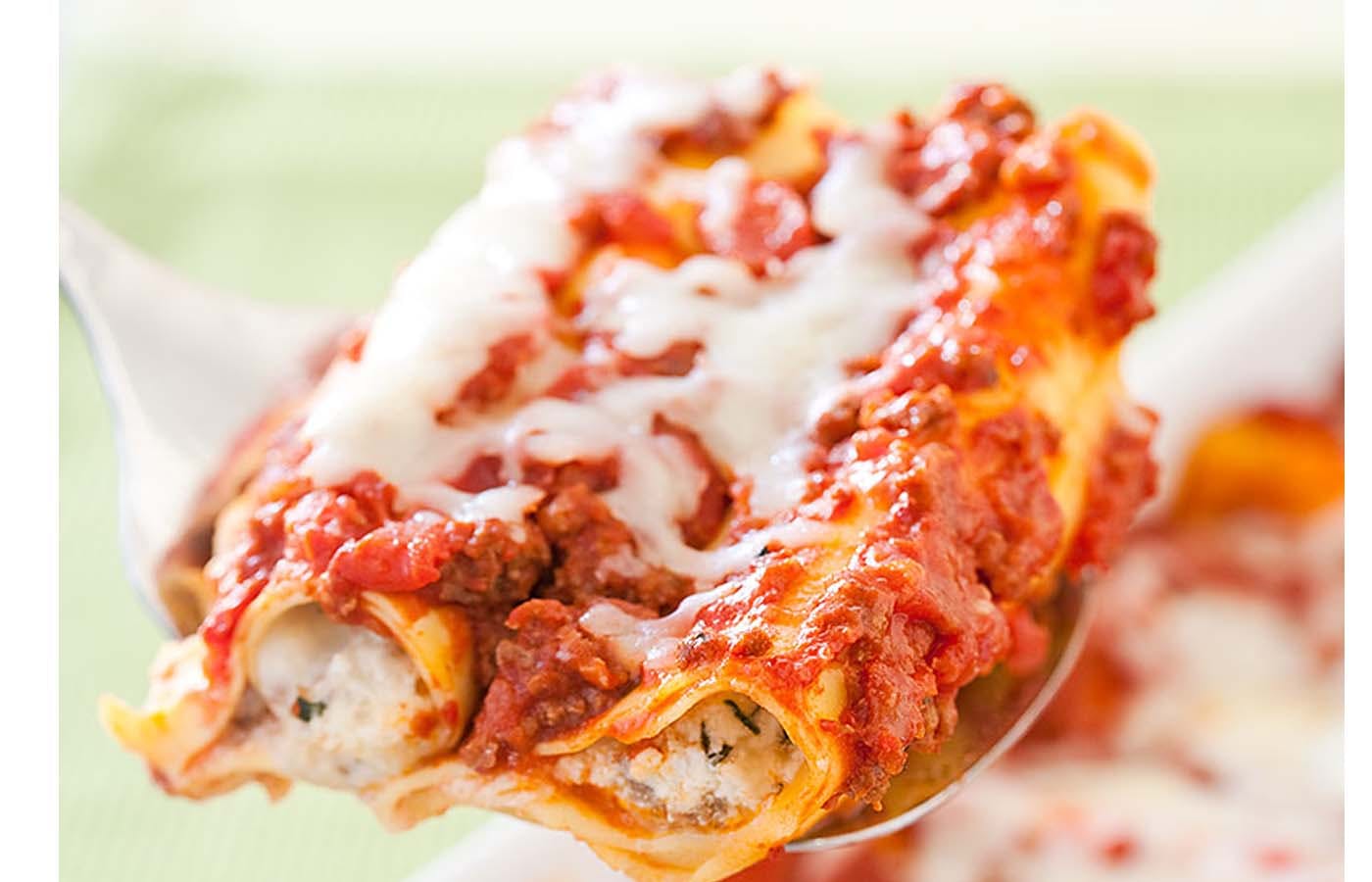 Order Baked Manicotti - Pasta food online from De Luca's store, San Diego on bringmethat.com