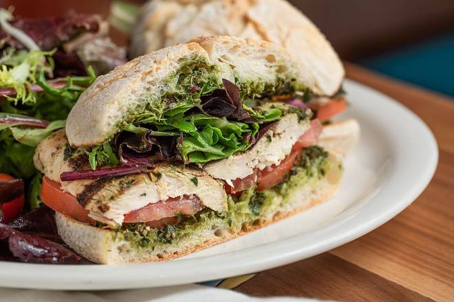 Order Grilled Cilantro Chicken with Pesto Sandwich - Half food online from Urth Caffe store, Laguna Beach on bringmethat.com