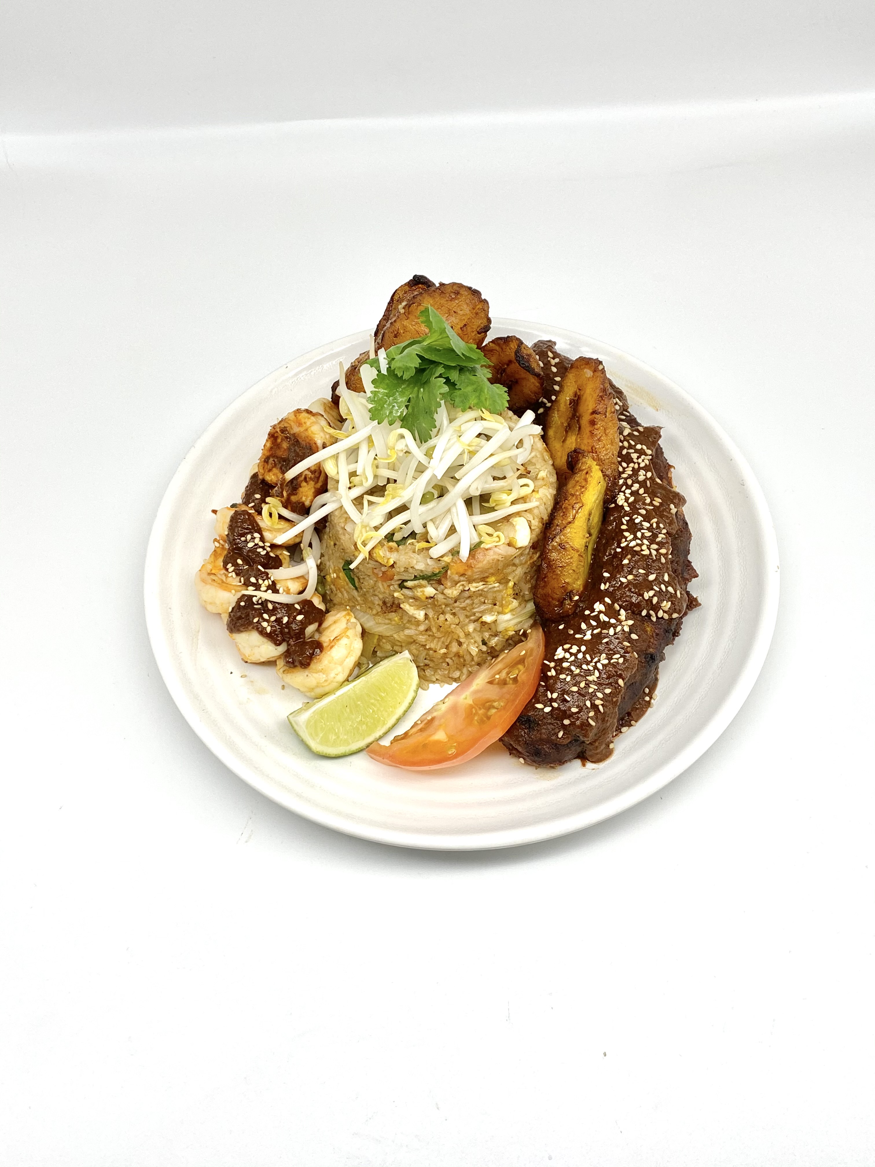 Order Regular Fried Rice with Maduros in mole sauce food online from Tacos Y Jugos Genesis store, Elmhurst on bringmethat.com