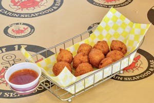 Order Hush Puppies (10 Pieces) food online from Pier 17 Seafood store, Louisville on bringmethat.com
