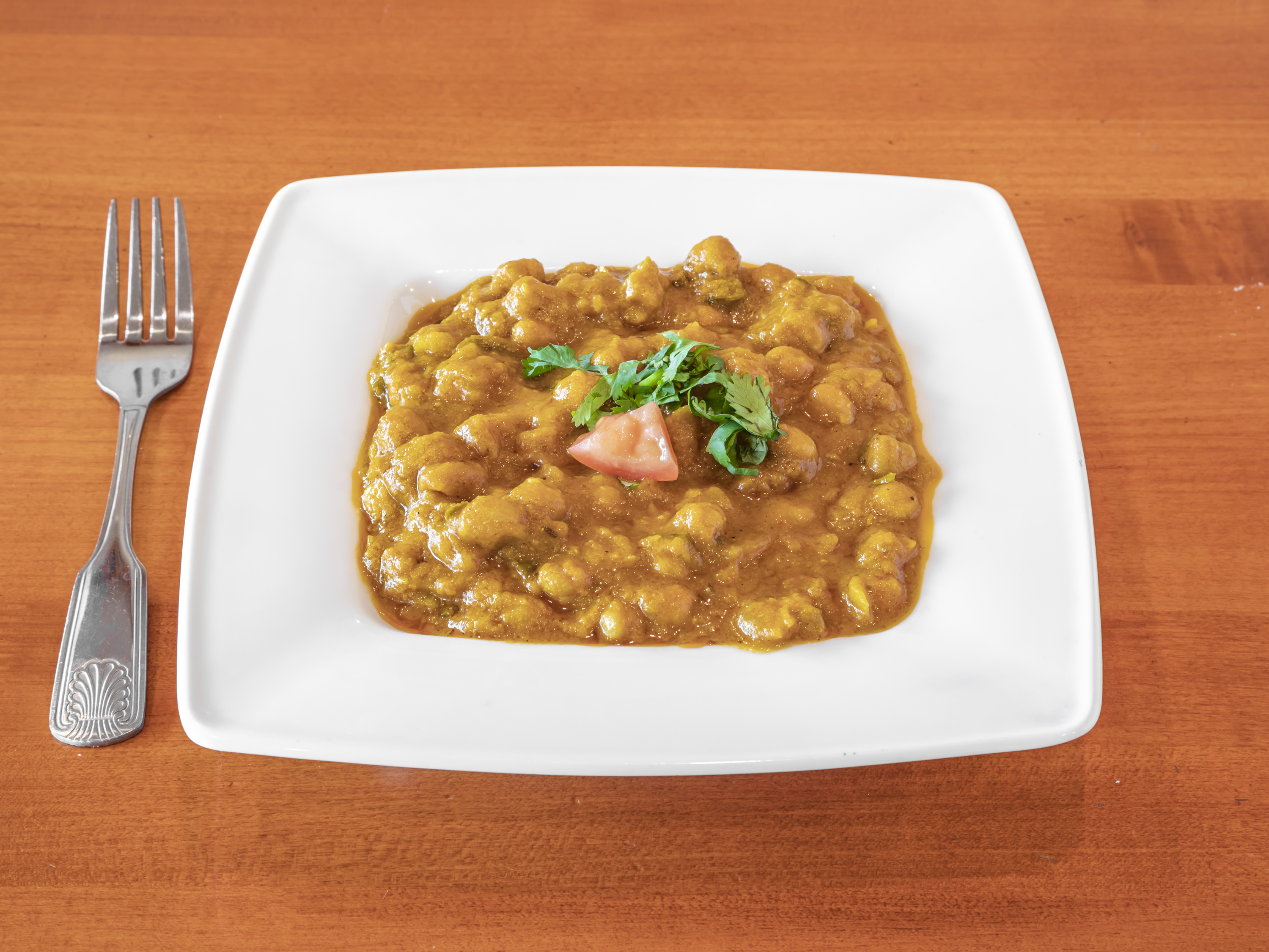 Order Channa Masala food online from Masala Indian Cuisine store, Scottsdale on bringmethat.com