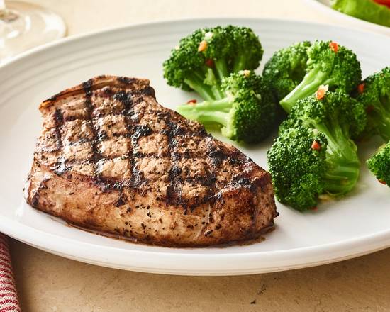 Order Tuscan-Grilled Pork Chop* - One Chop  food online from Carrabba's store, Greensboro on bringmethat.com