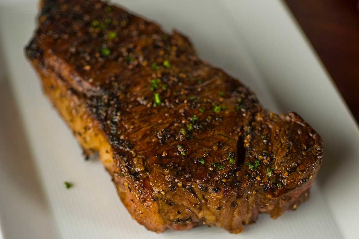 Order PRIME NEW YORK STRIP food online from Sullivan's Steakhouse store, Omaha on bringmethat.com