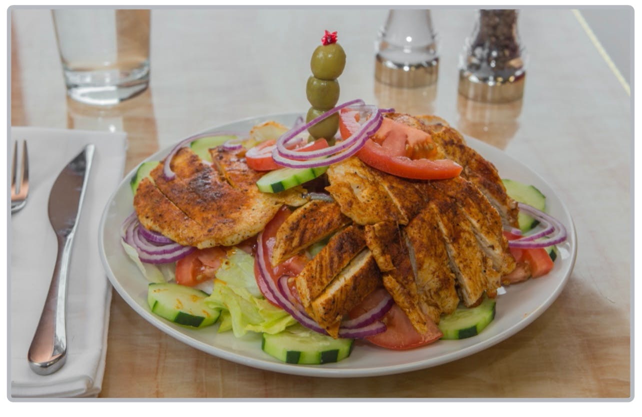 Order Cajun Grilled Chicken Salad - Salad food online from Tuscan Pizza store, Sicklerville on bringmethat.com