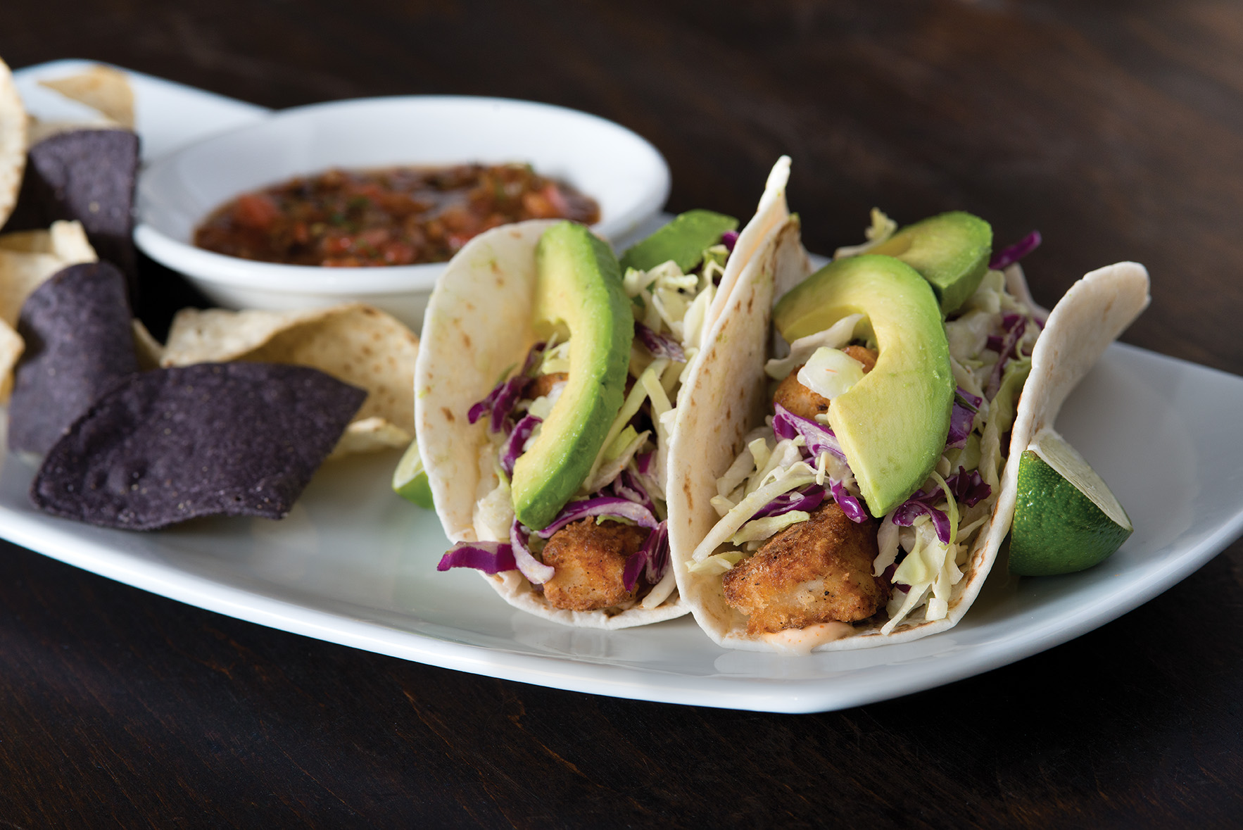 Order Crispy Fish Tacos  food online from California Pizza Kitchen - River City Dr store, Jacksonville on bringmethat.com