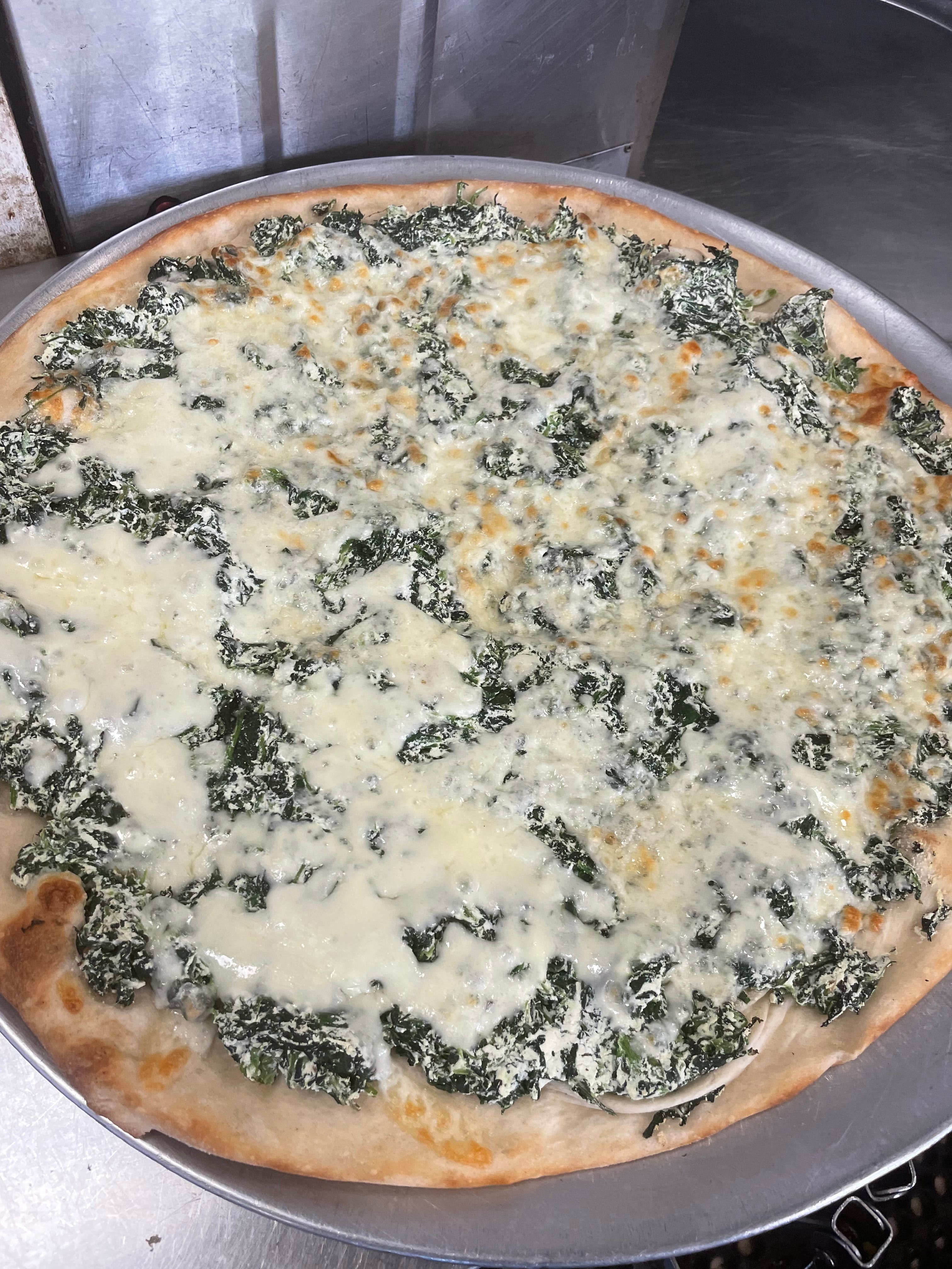 Order Spinach White Pizza - Mini Personal food online from Regina Pizza store, Lynbrook on bringmethat.com