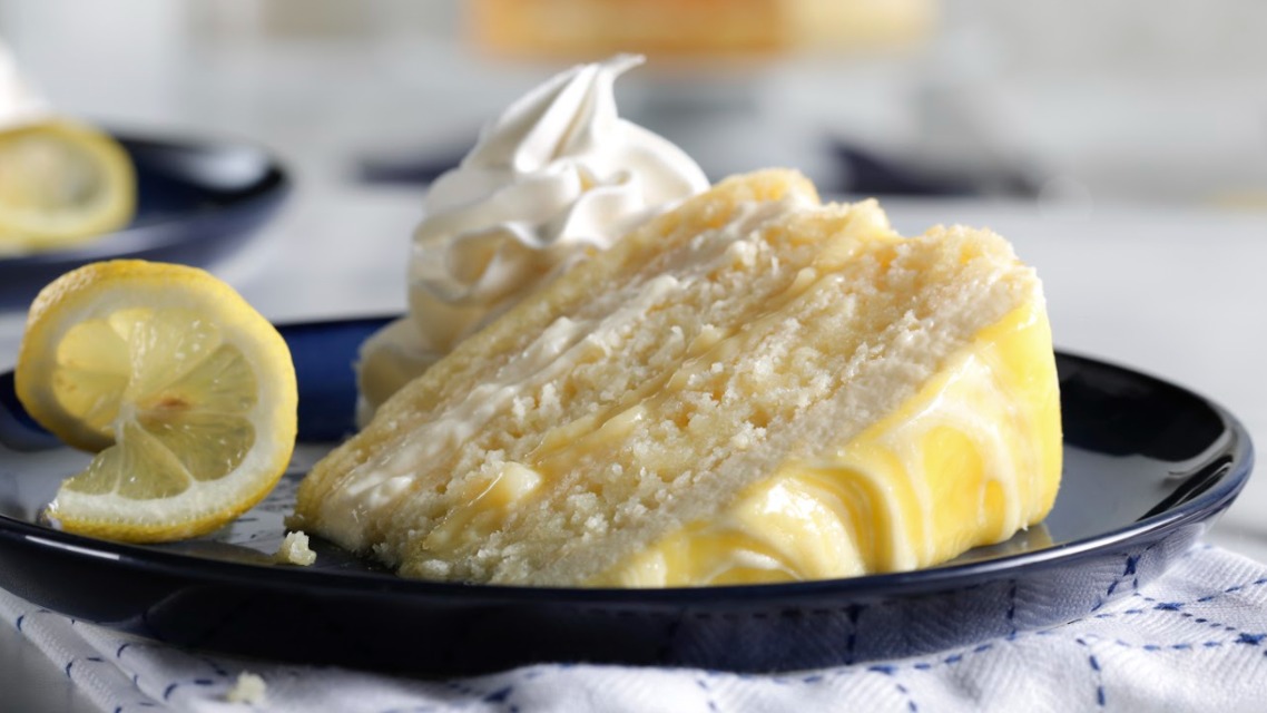 Order Lemon Layer Cake food online from Mimis Cafe store, Folsom on bringmethat.com