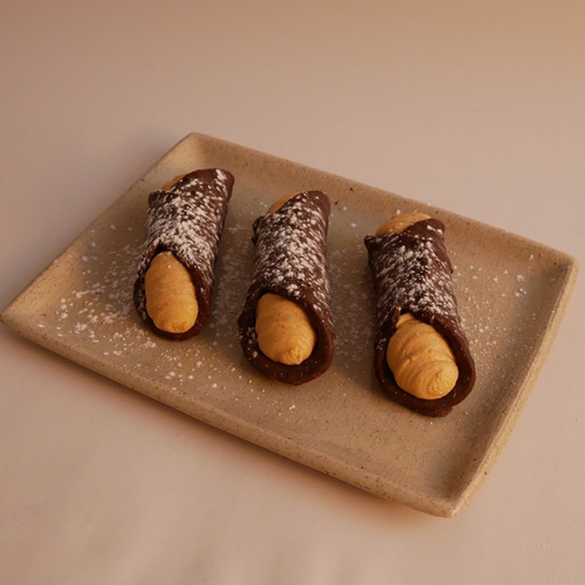 Order Pumpkin Chocolate-Dipped Cannoli food online from Carlo's Bakery store, Bloomington on bringmethat.com
