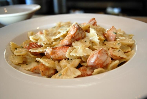 Order Bowtie Pasta with Cubed Grilled Salmon food online from Rosti Tuscan Kitchen store, Santa Monica on bringmethat.com