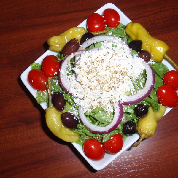 Order Greek Salad food online from Pizza Paradise store, Austin on bringmethat.com