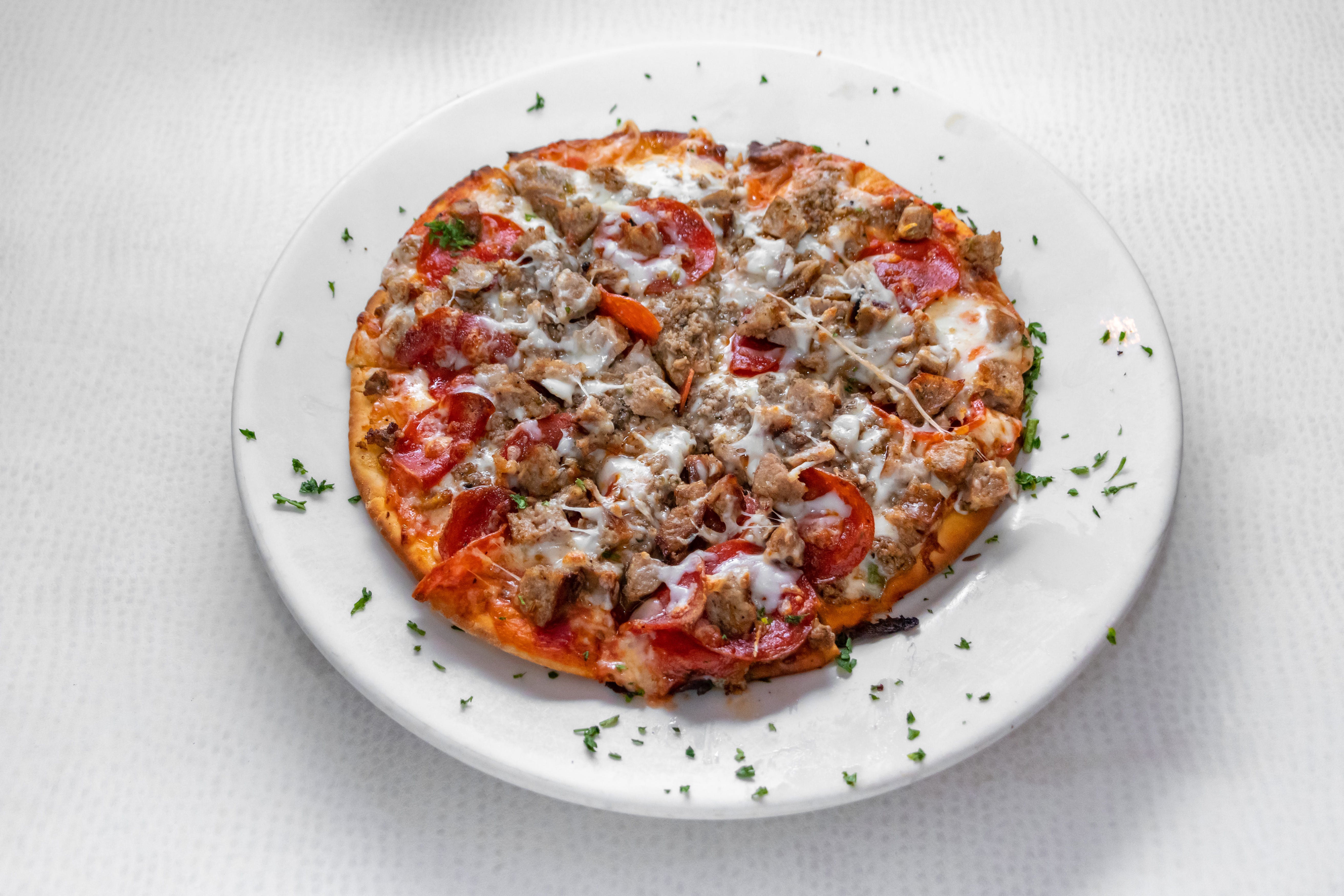 Order Bolognese Pizza - 10'' (8 Slices) food online from Prima Pasta Restaurant store, Houston on bringmethat.com