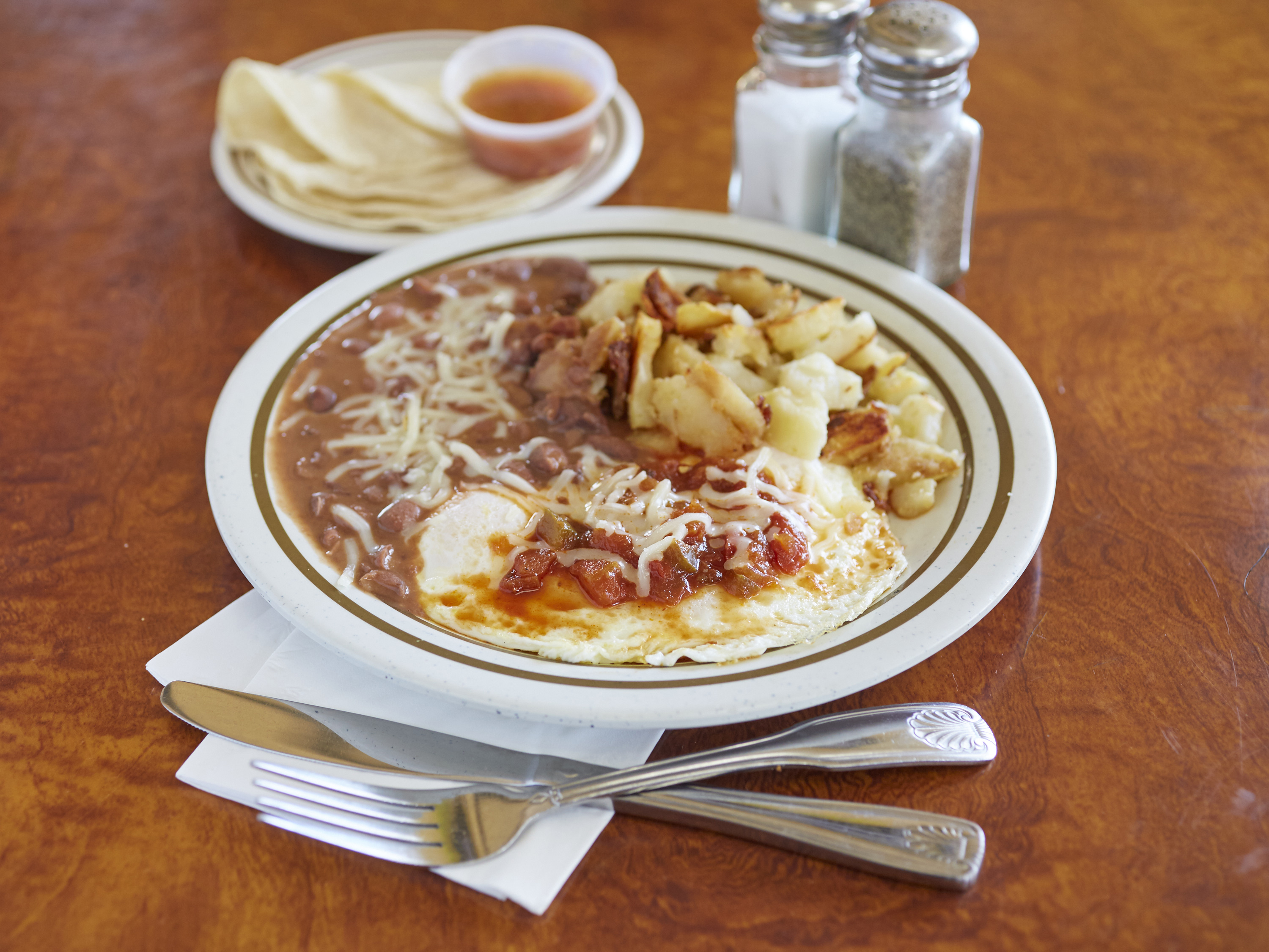 Order 3 Huevos Rancheros food online from Breakfast Cafe store, Oak Park on bringmethat.com