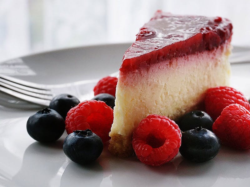 Order New York Cheesecake with Strawberry Topping - Dessert food online from Wise Guys Deli Cumberland store, Cumberland on bringmethat.com