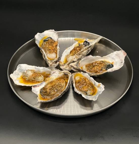 Order Garlic Butter Oyster (6) food online from Carolina Crabhouse store, North Charleston on bringmethat.com