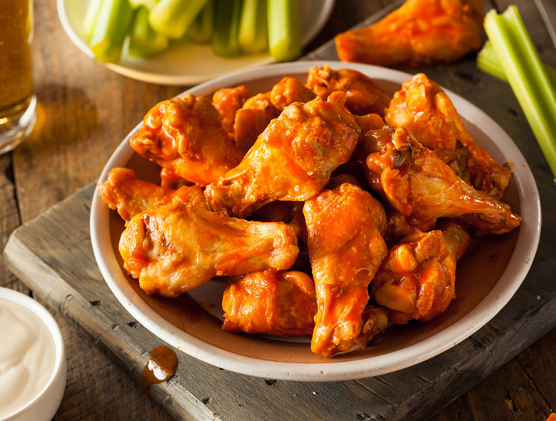 Order Wings hot & spicy  food online from Hunt Brother Pizza store, Bloomington on bringmethat.com