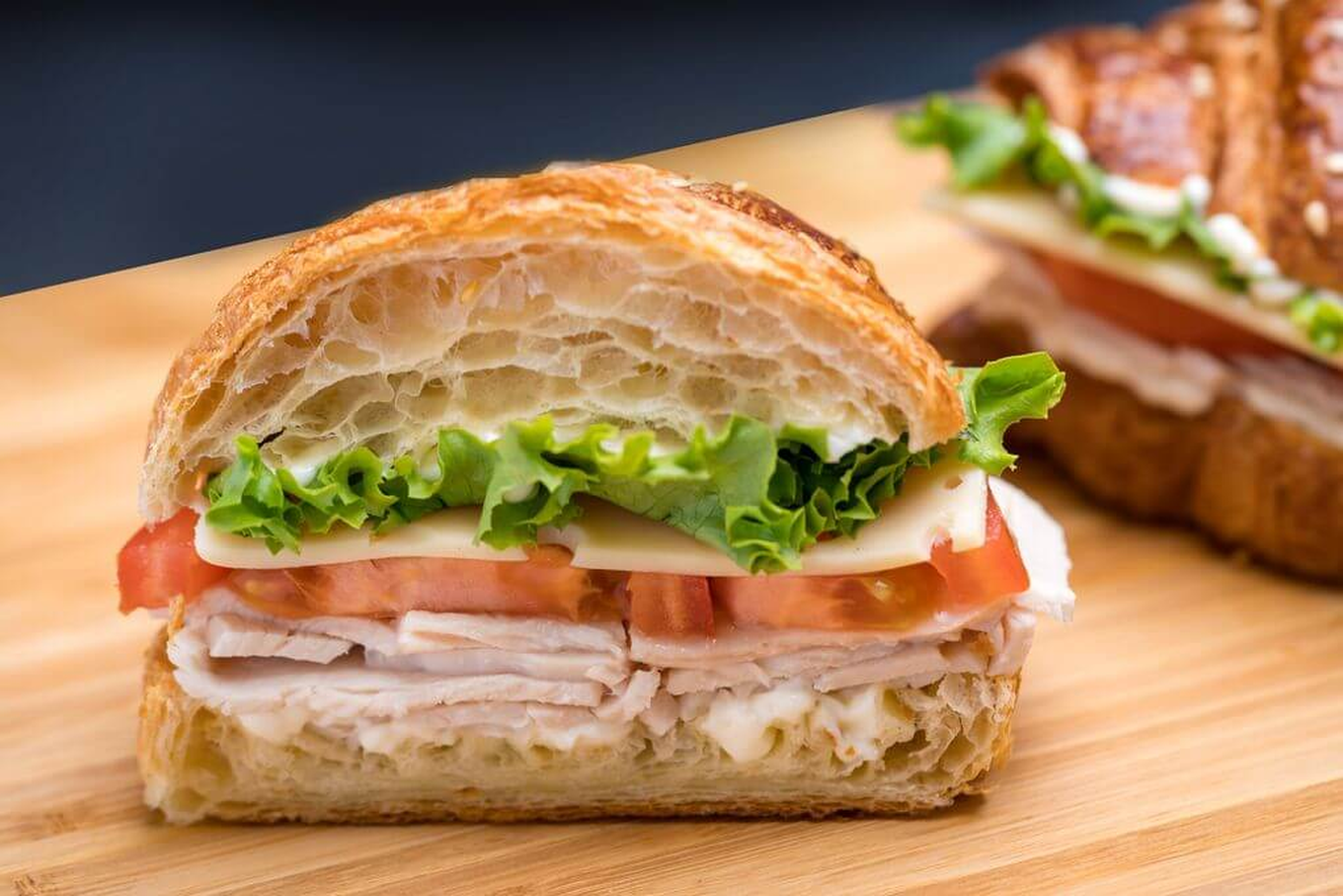 Order Turkey and Cheese Croissant Sandwich food online from Coffee And Cake Cafe store, Houston on bringmethat.com