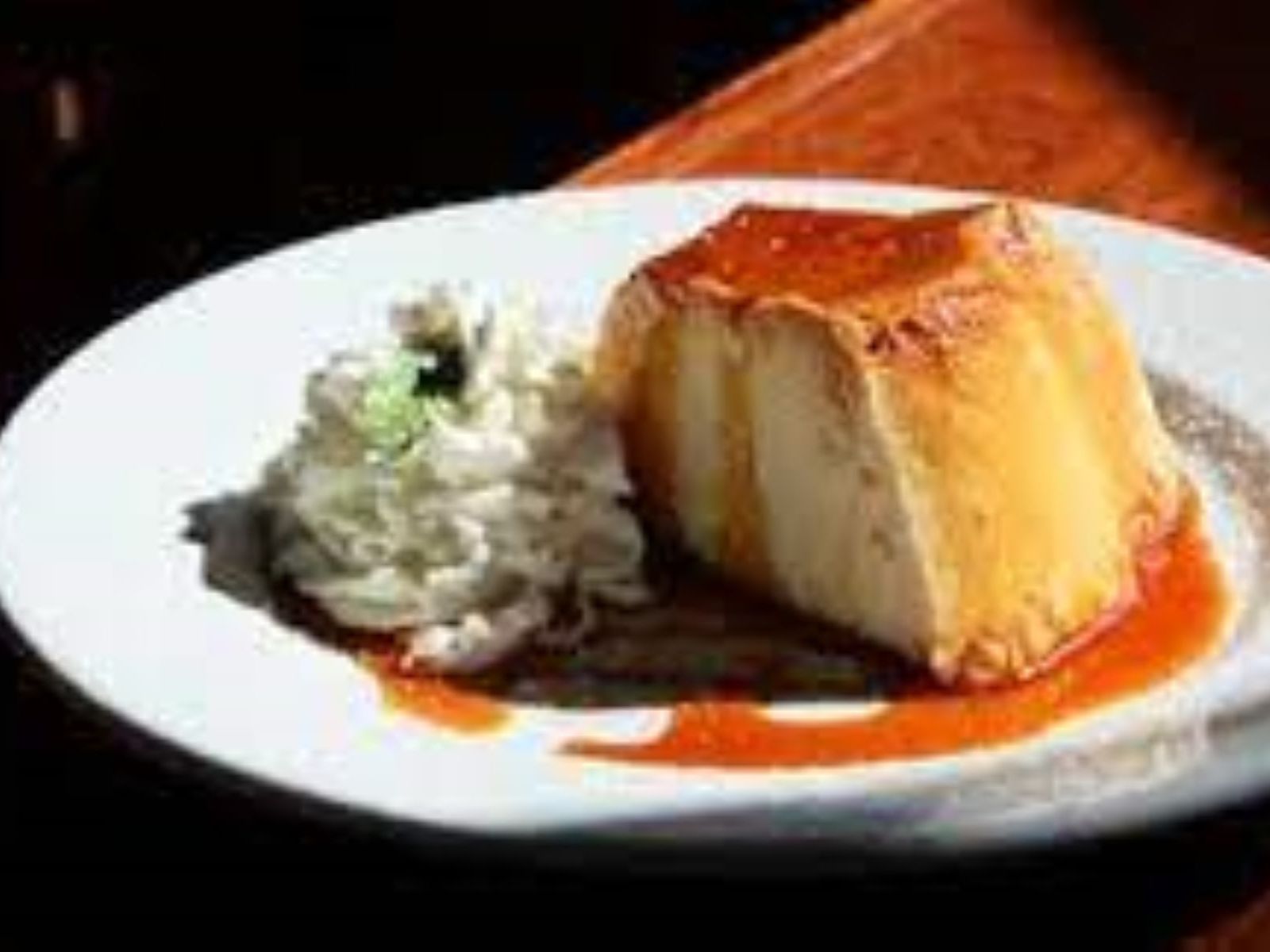 Order Flan food online from Antigua Latin Inspired Kitchen store, Milwaukee on bringmethat.com