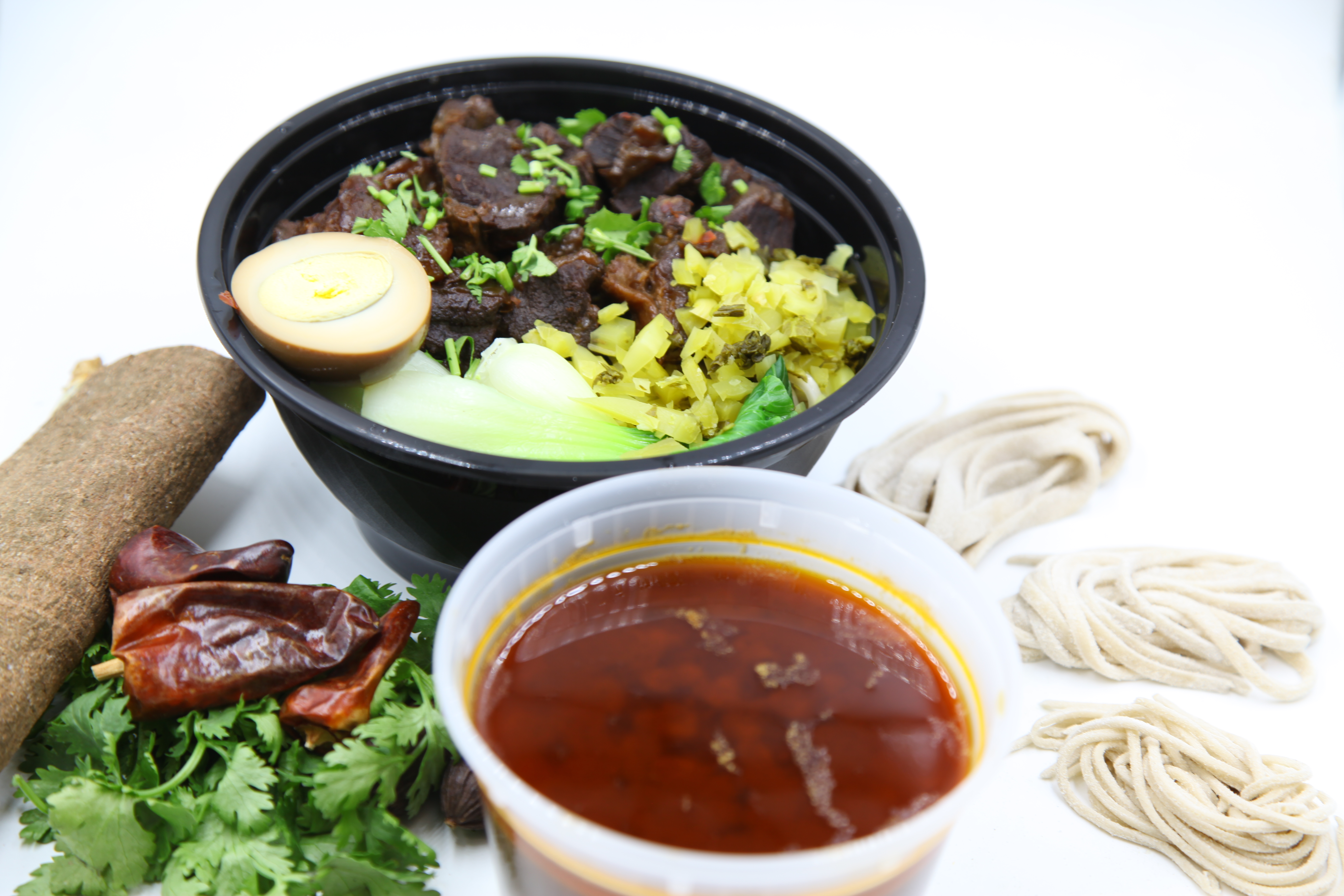 Order Signature Spicy Beef Noodle Soup 特色麻辣牛肉 food online from IQ Kitchen store, Newton Highlands on bringmethat.com