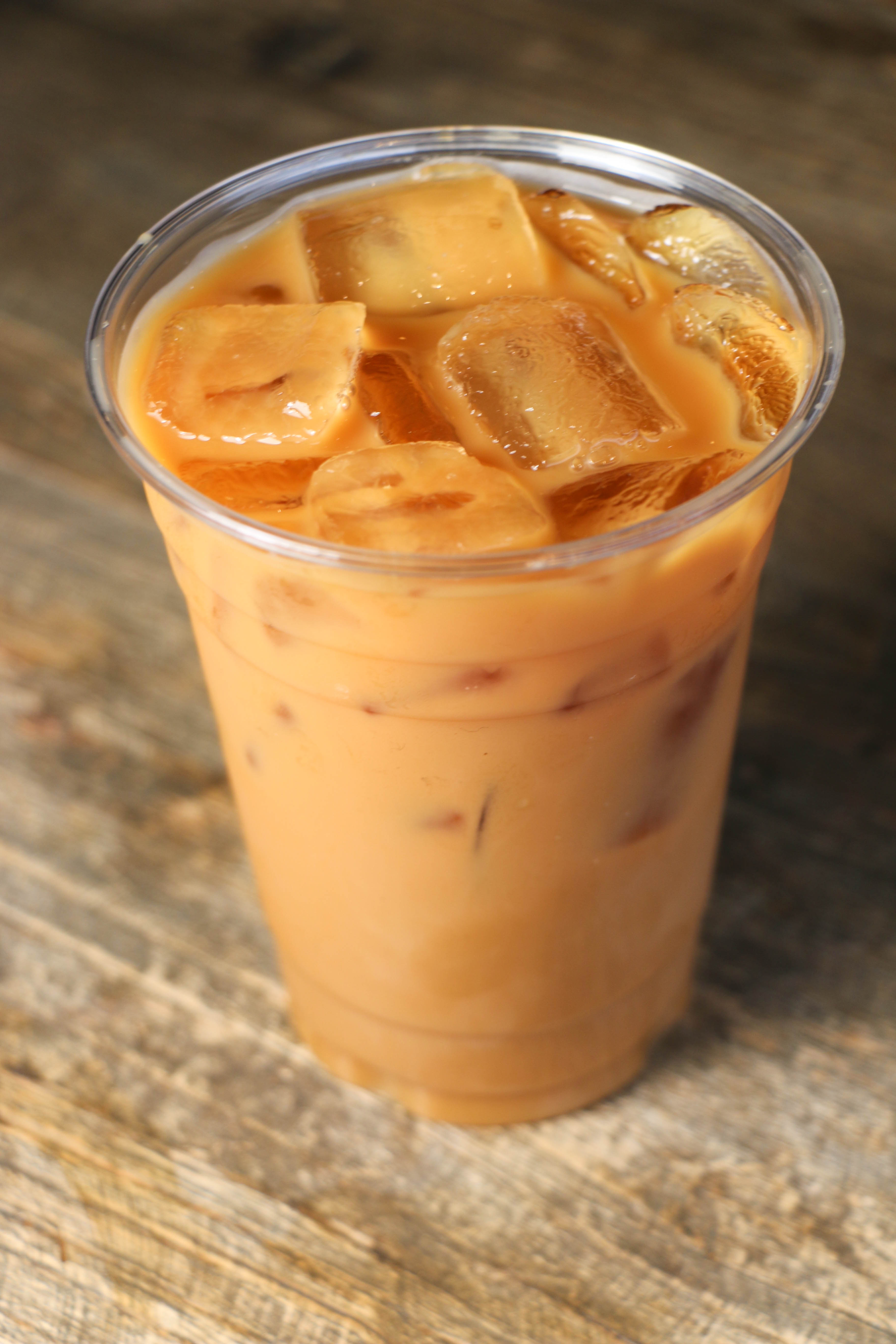 Order Iced Latte with Added Flavor Syrup food online from Fuel America store, Brighton on bringmethat.com
