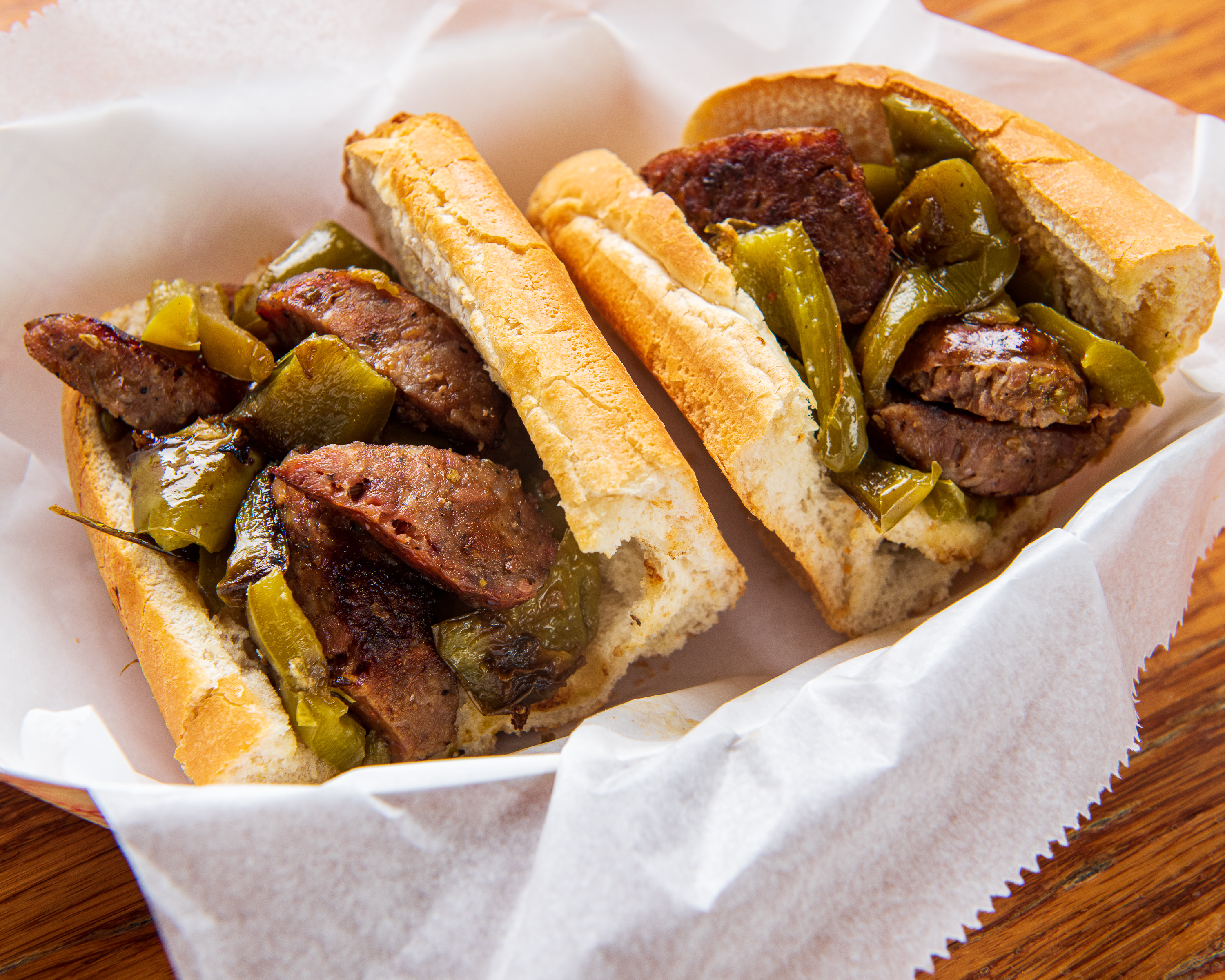 Order Sausage and Pepper Sandwich food online from Iggy Doughboys & Chowder House store, Warwick on bringmethat.com