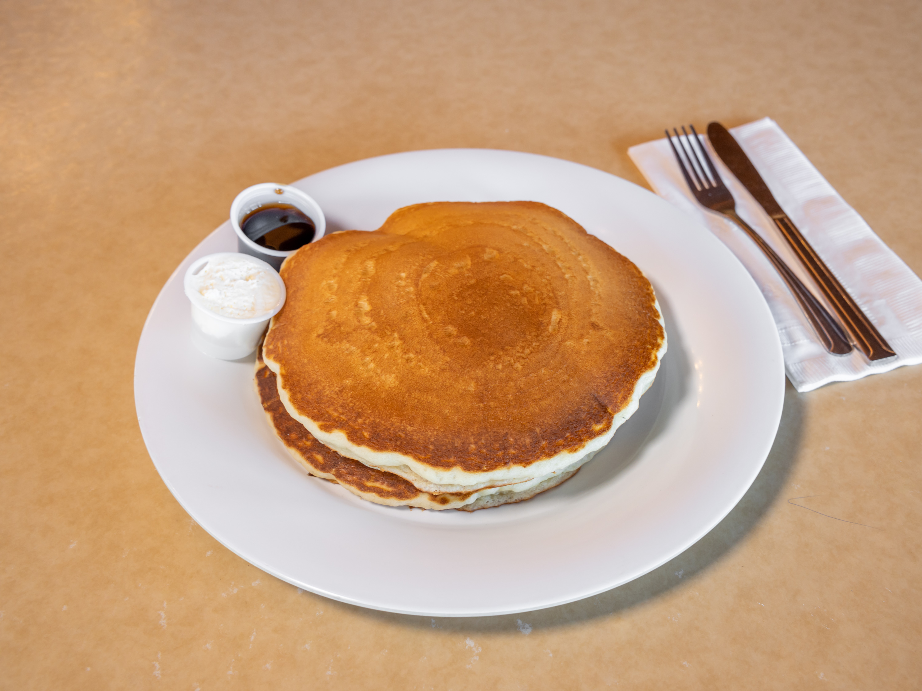 Order Homemade Buttermilk Pancakes food online from Sloan Restaurant store, Indio on bringmethat.com