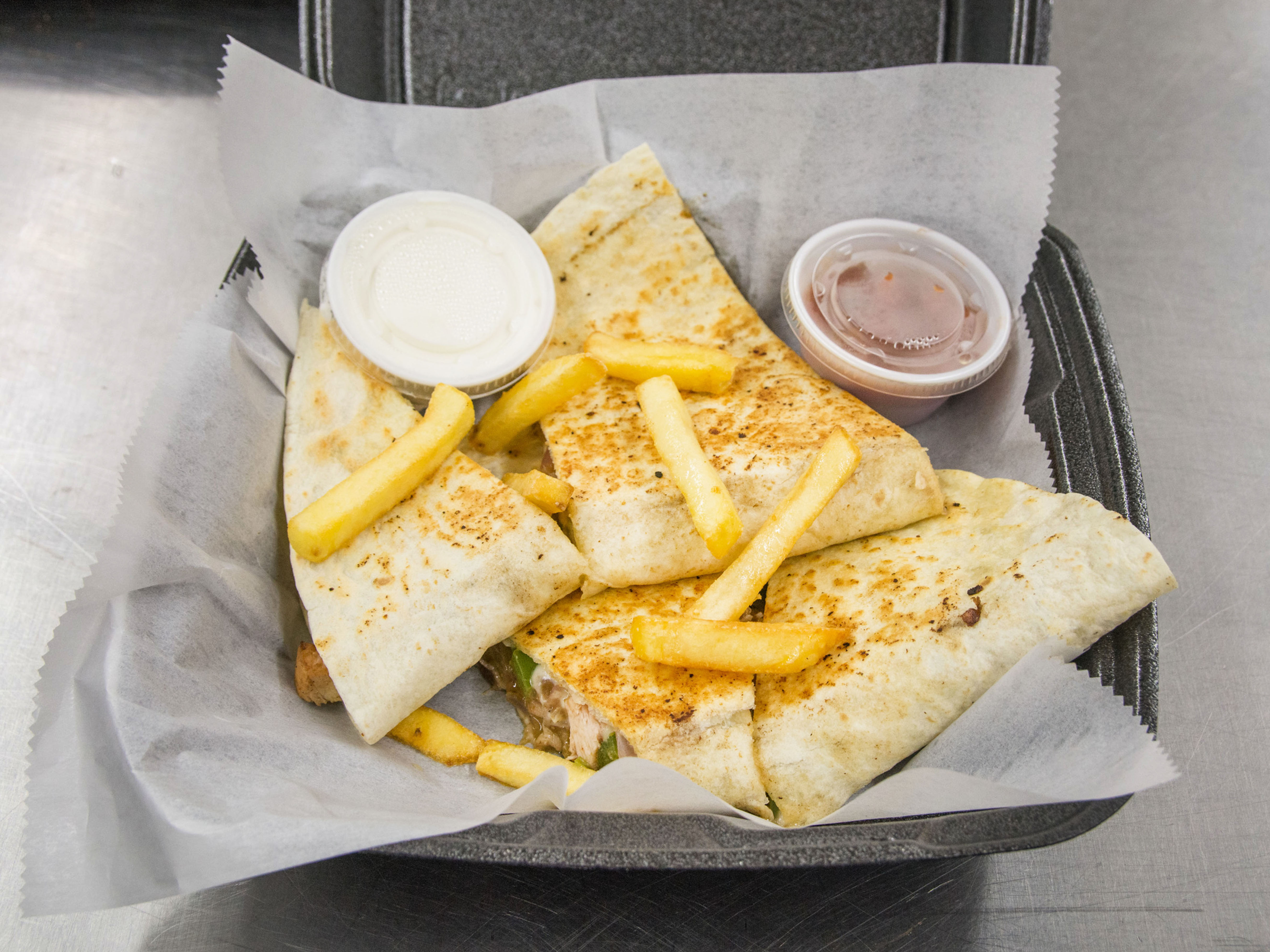 Order Grilled Chicken Quesadilla food online from Caton Pizza & Subs store, Baltimore on bringmethat.com