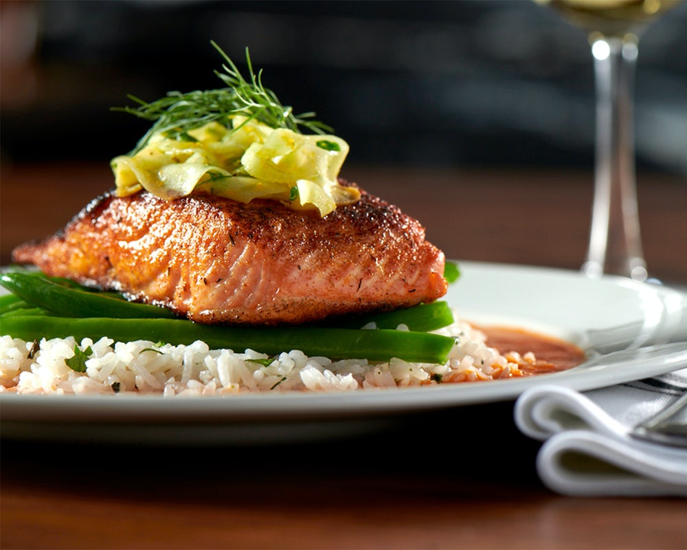 Order Salmon Romesco food online from Burtons Grill store, South Windsor on bringmethat.com