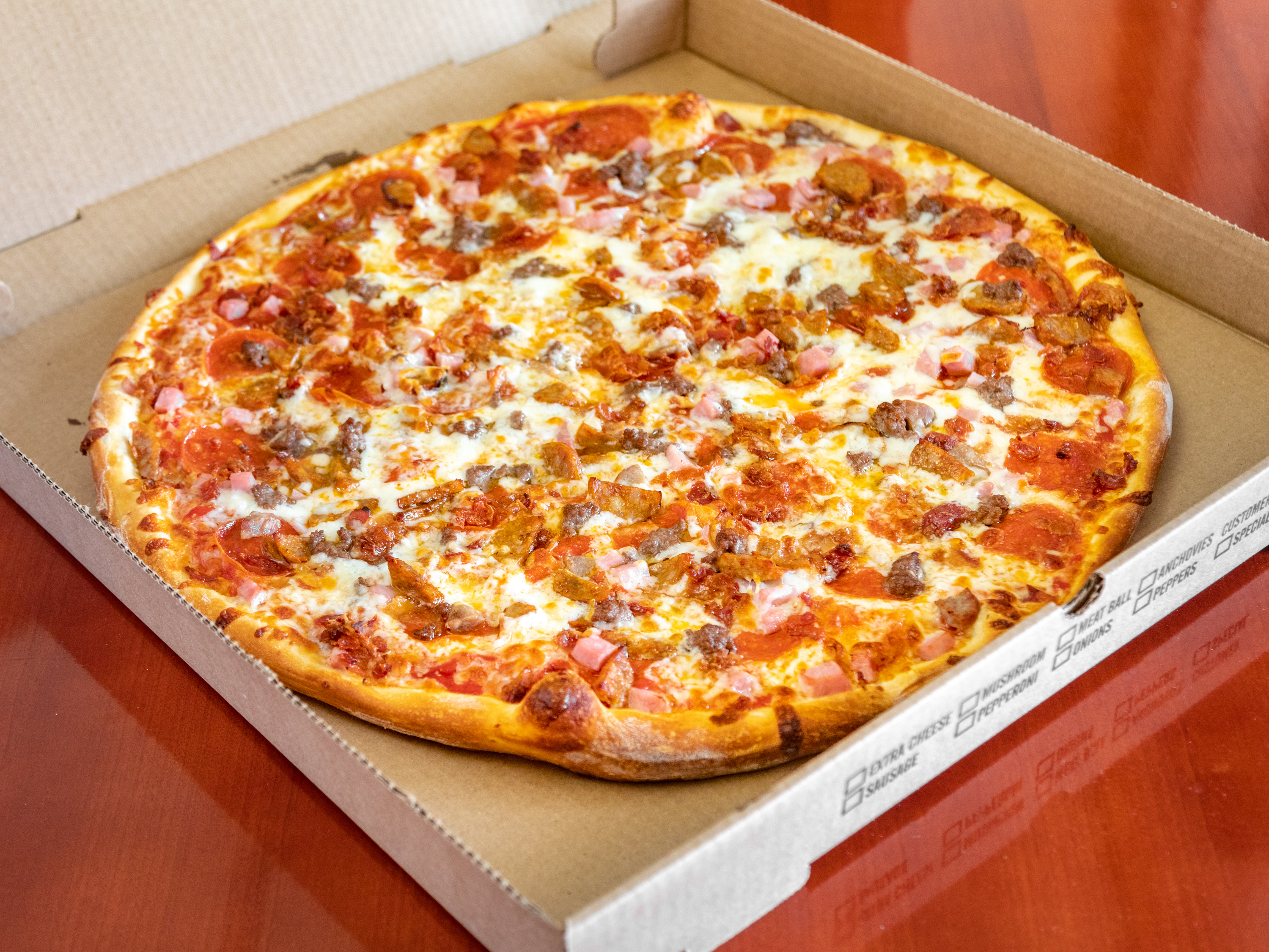 Order Meat Lovers Pizza food online from Millie's Kitchen store, Westfield on bringmethat.com