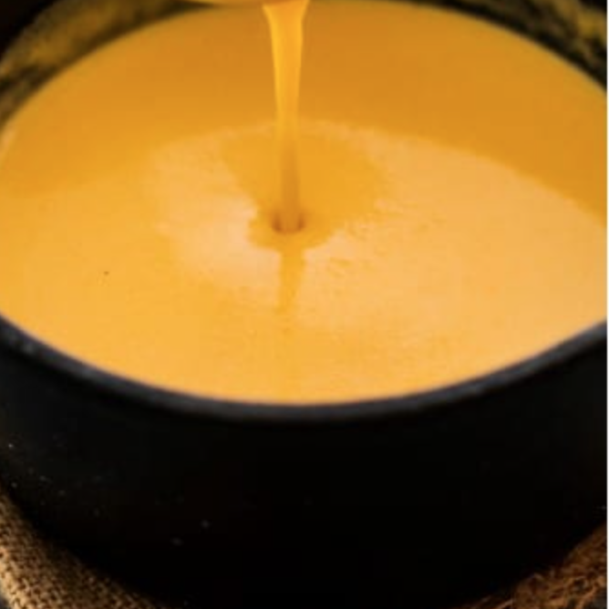 Order Side of Cheddar Cheese Sauce food online from Dan And John's Wings store, New York on bringmethat.com