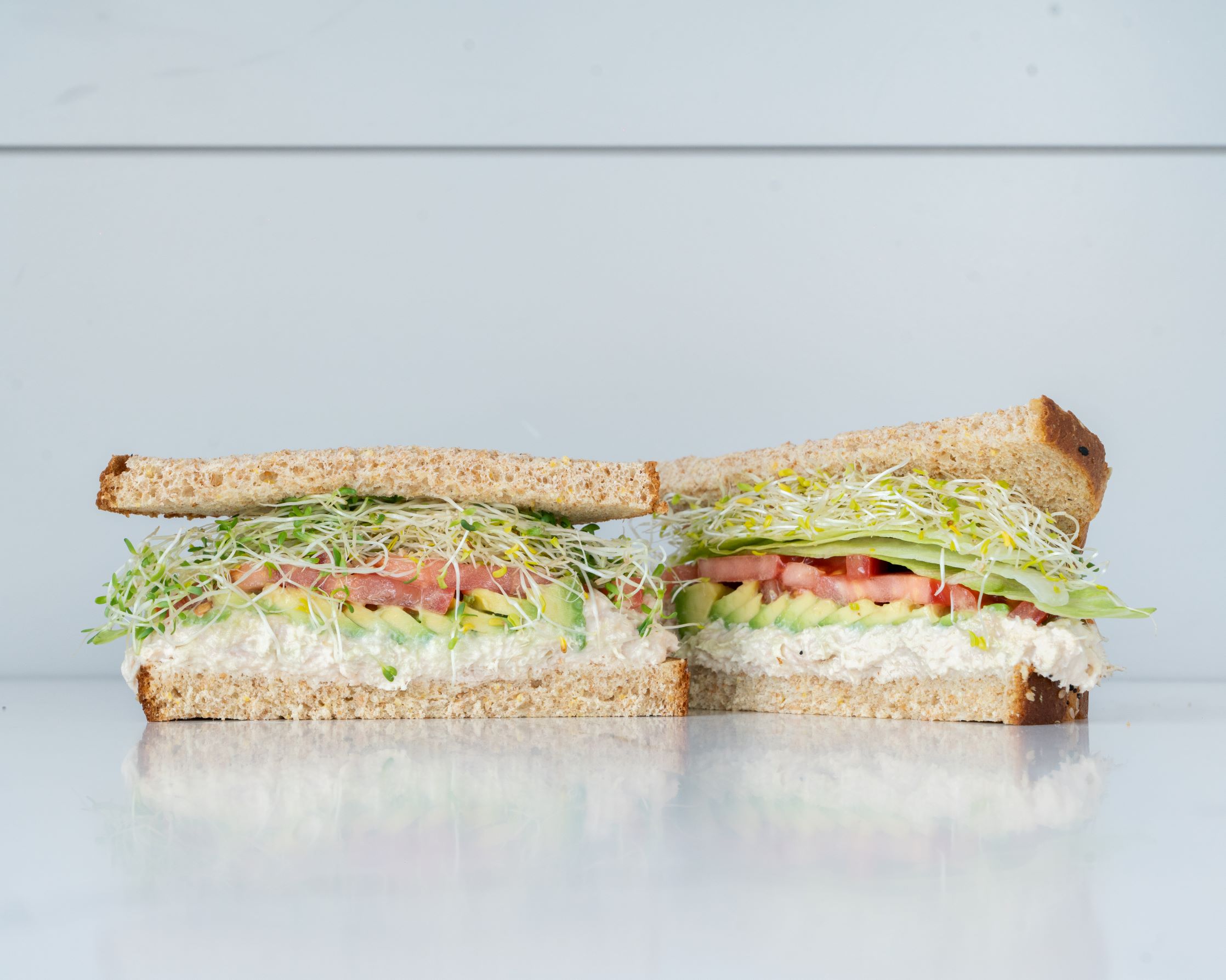 Order tuna avocado sandwich food online from Health Nut store, Woodland Hills on bringmethat.com