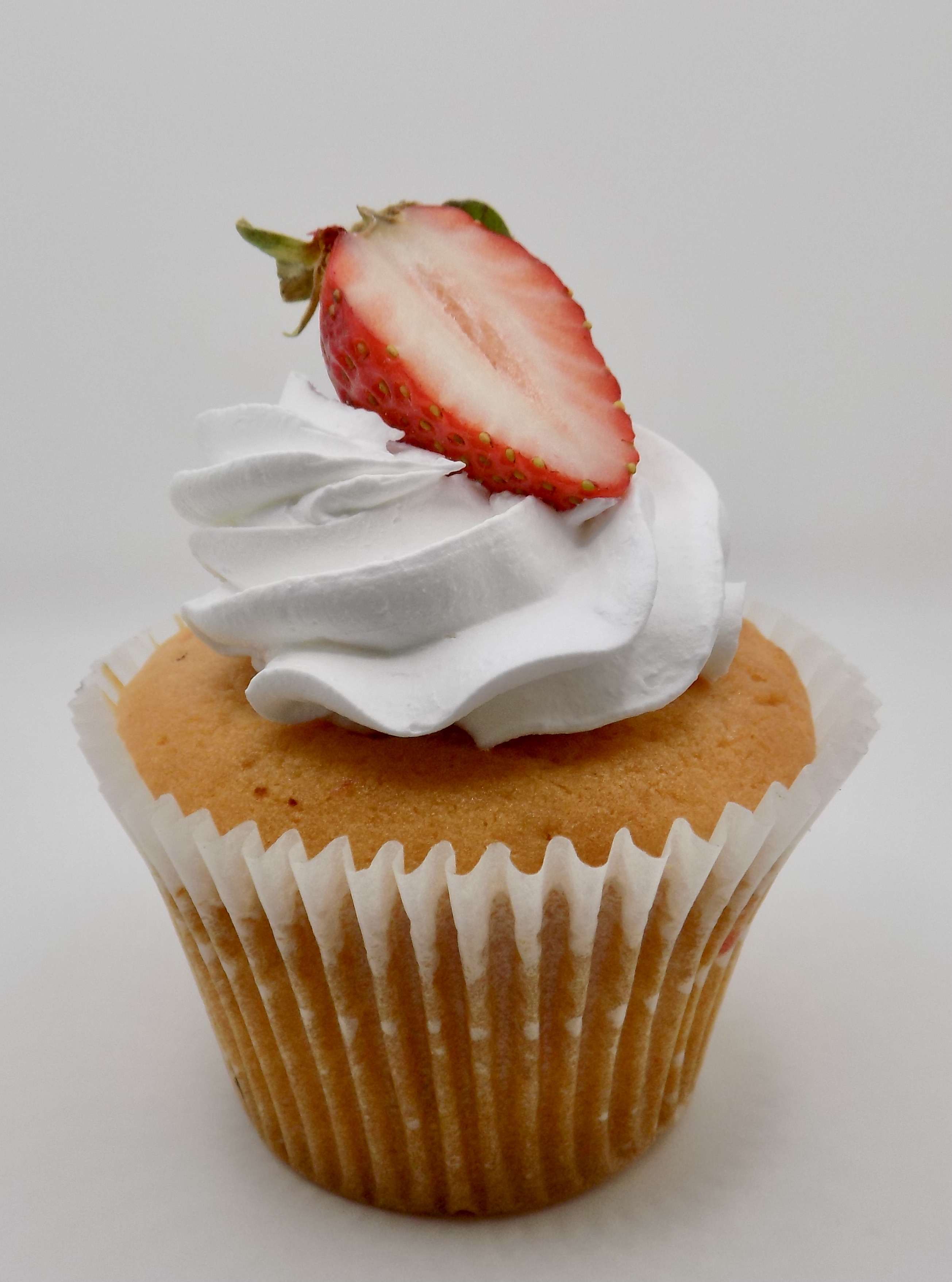 Order Strawberries and Cream Cupcake food online from Lil Cakes & Creamery store, Gaithersburg on bringmethat.com