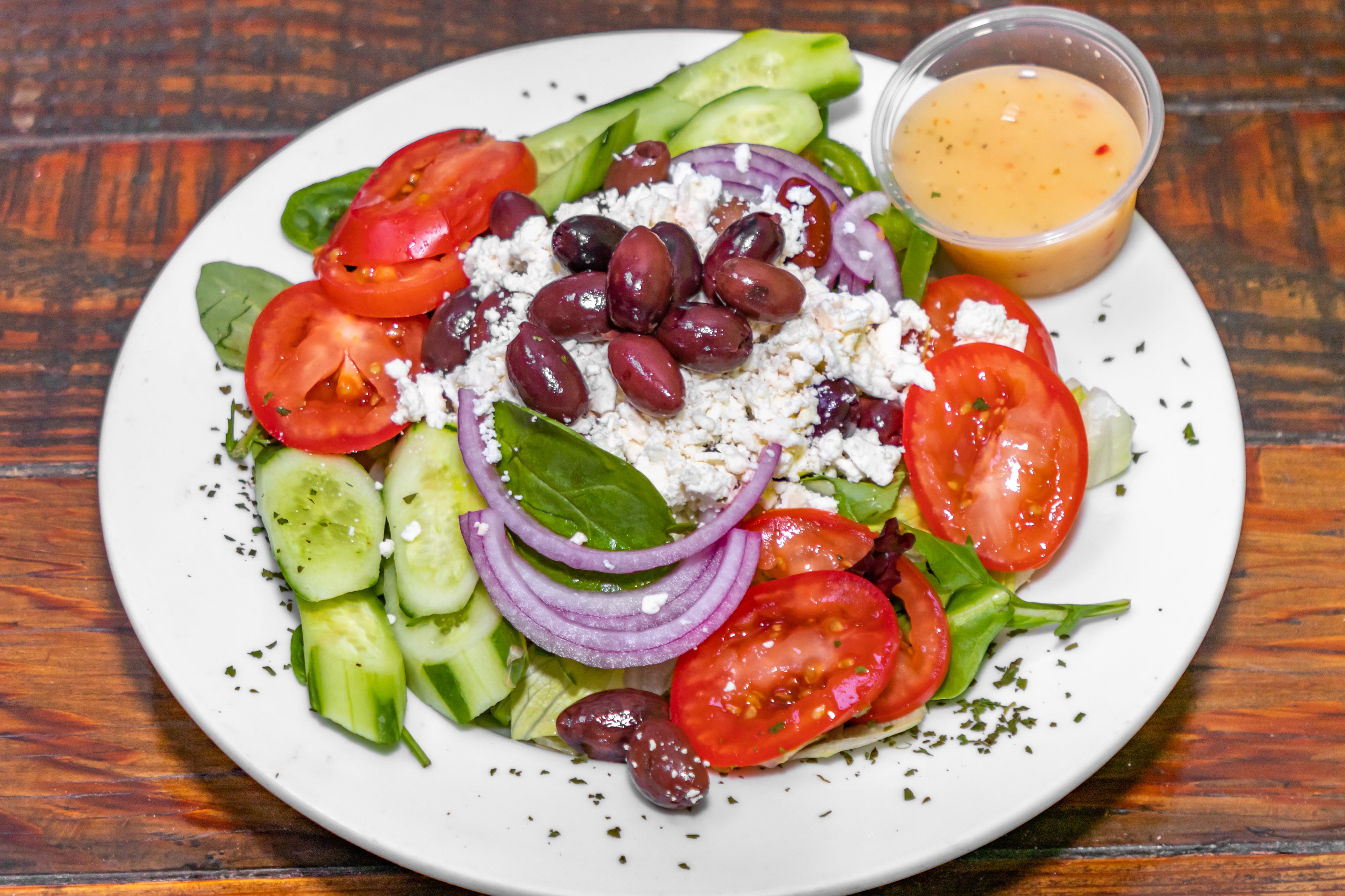 Order Greek Salad - Medium food online from Brothers Pizza store, Las Vegas on bringmethat.com