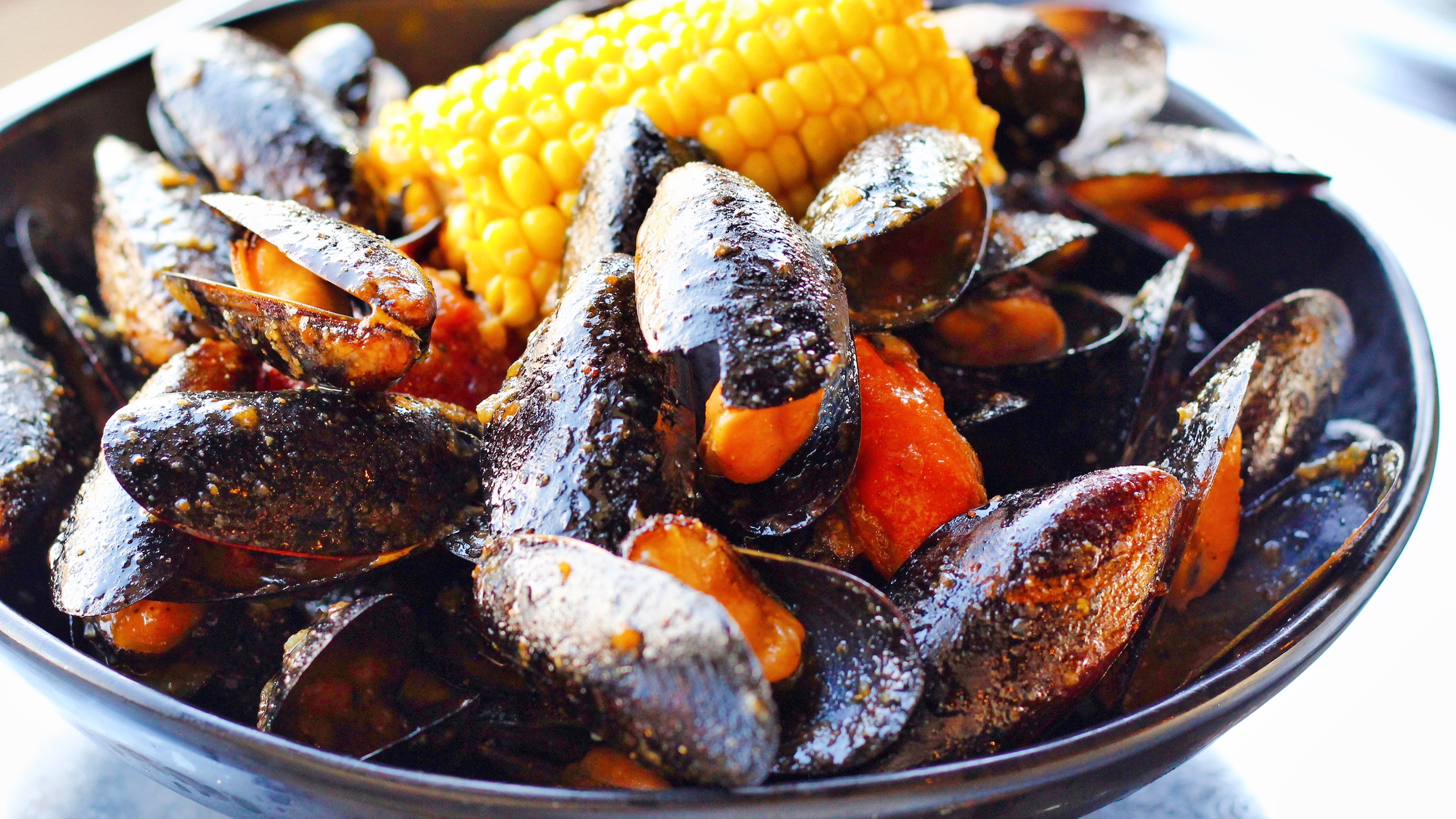 Order M9. Black Mussel (1Lb) food online from Captain King Seafood City store, Memphis on bringmethat.com