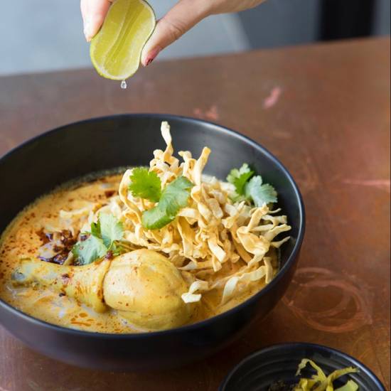 Order Khao Soi food online from Otus Thai Kitchen & Coffee store, West Hollywood on bringmethat.com
