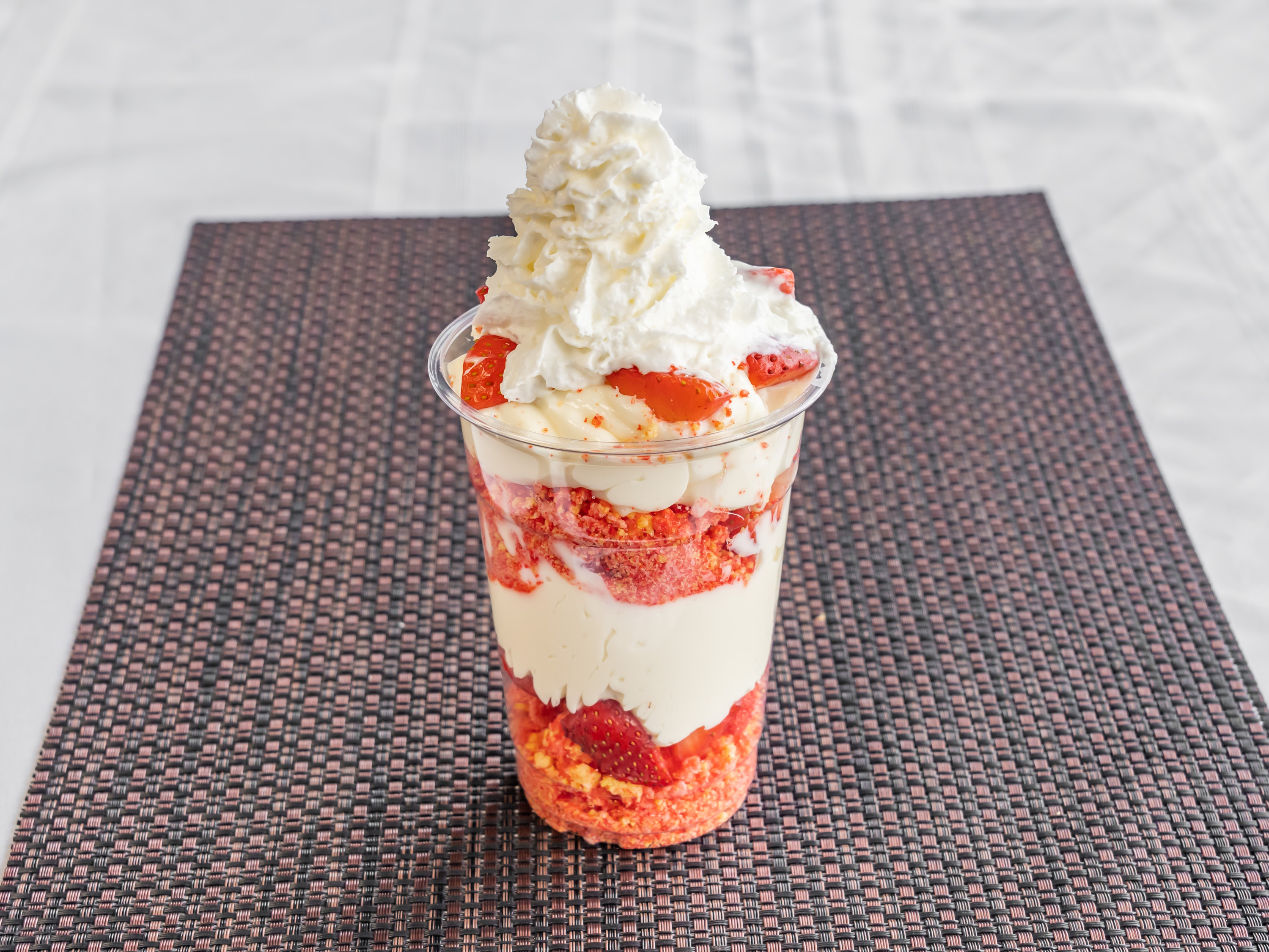 Order 16oz Strawberry Crunch Cheesecake Cup food online from Sweetalicious Sweets store, Madison Heights on bringmethat.com