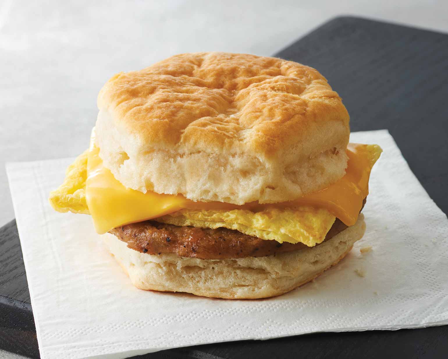 Order Breakfast Egg And Sausage Biscuit Sandwich food online from Chevron Extramile store, Cameron Park on bringmethat.com