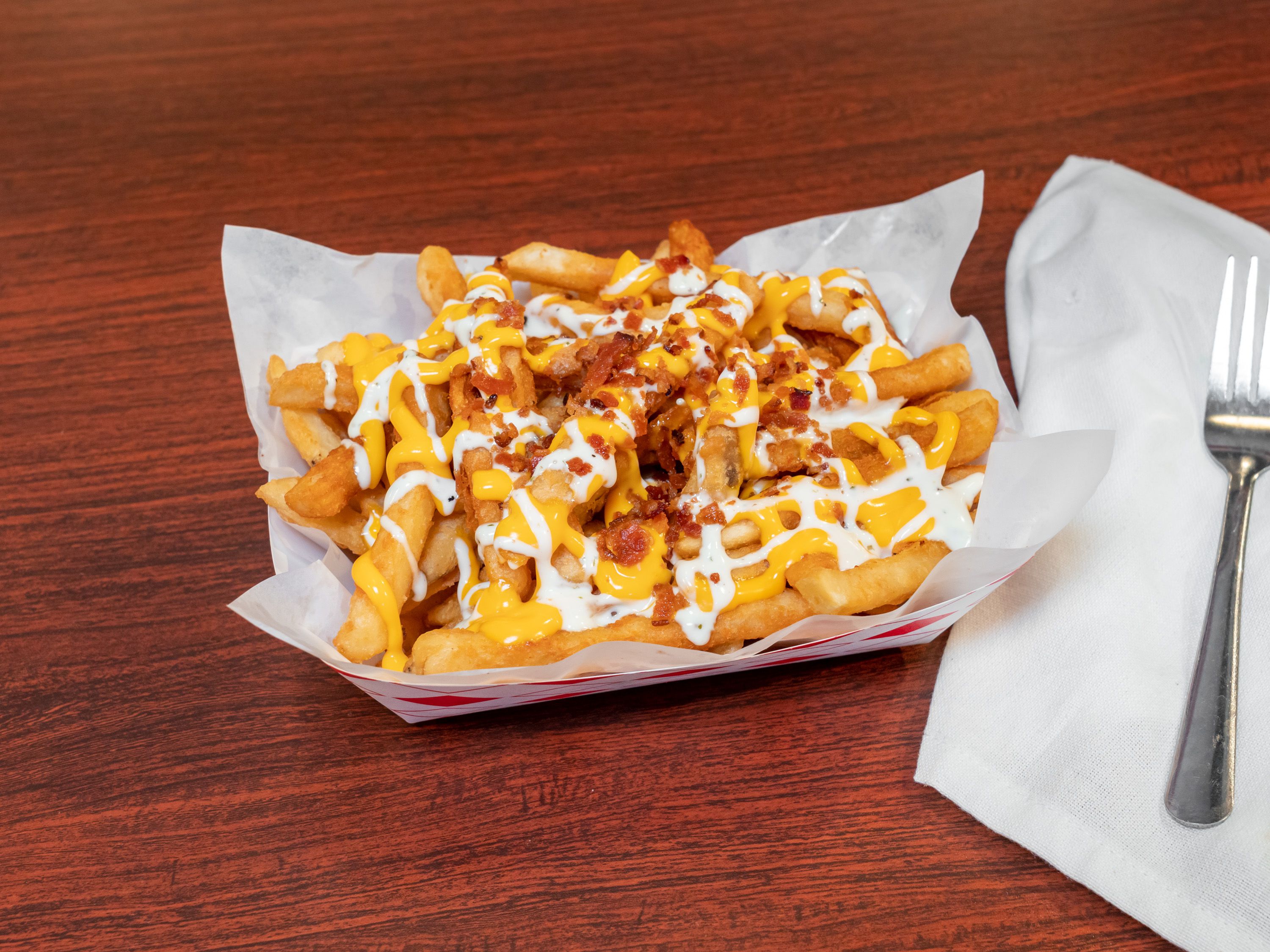 Order Bacon Cheddar Ranch Fries food online from Fried Or Boiled Seafood Fusion store, Fresno on bringmethat.com