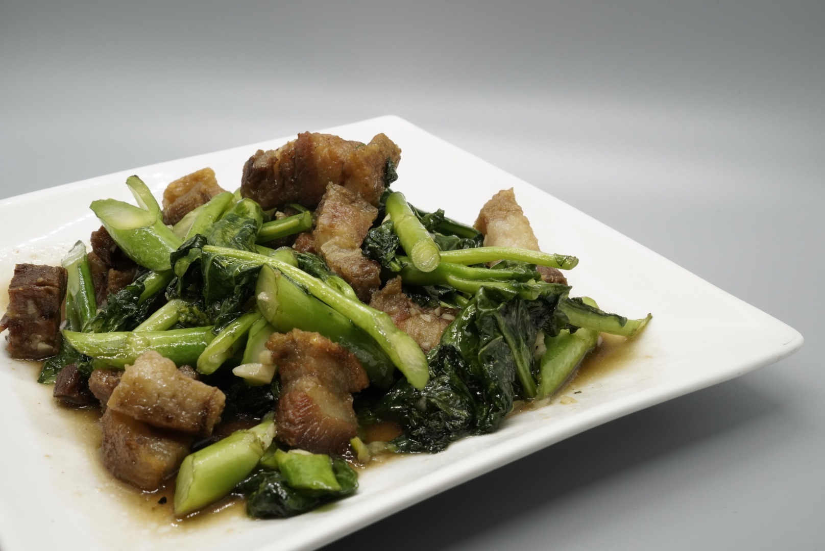 Order 47. Chinese Broccoli with Crispy Pork food online from Royal Orchid Thai II store, Riverside on bringmethat.com