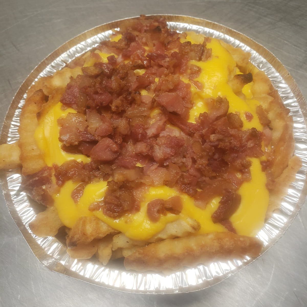 Order French Fries with Cheese & Bacon - Small food online from Drake Pizza store, Allentown on bringmethat.com