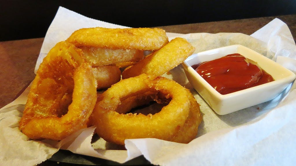 Order Onion Rings - 8 Pieces food online from Nicky's Pizza store, Sheboygan on bringmethat.com